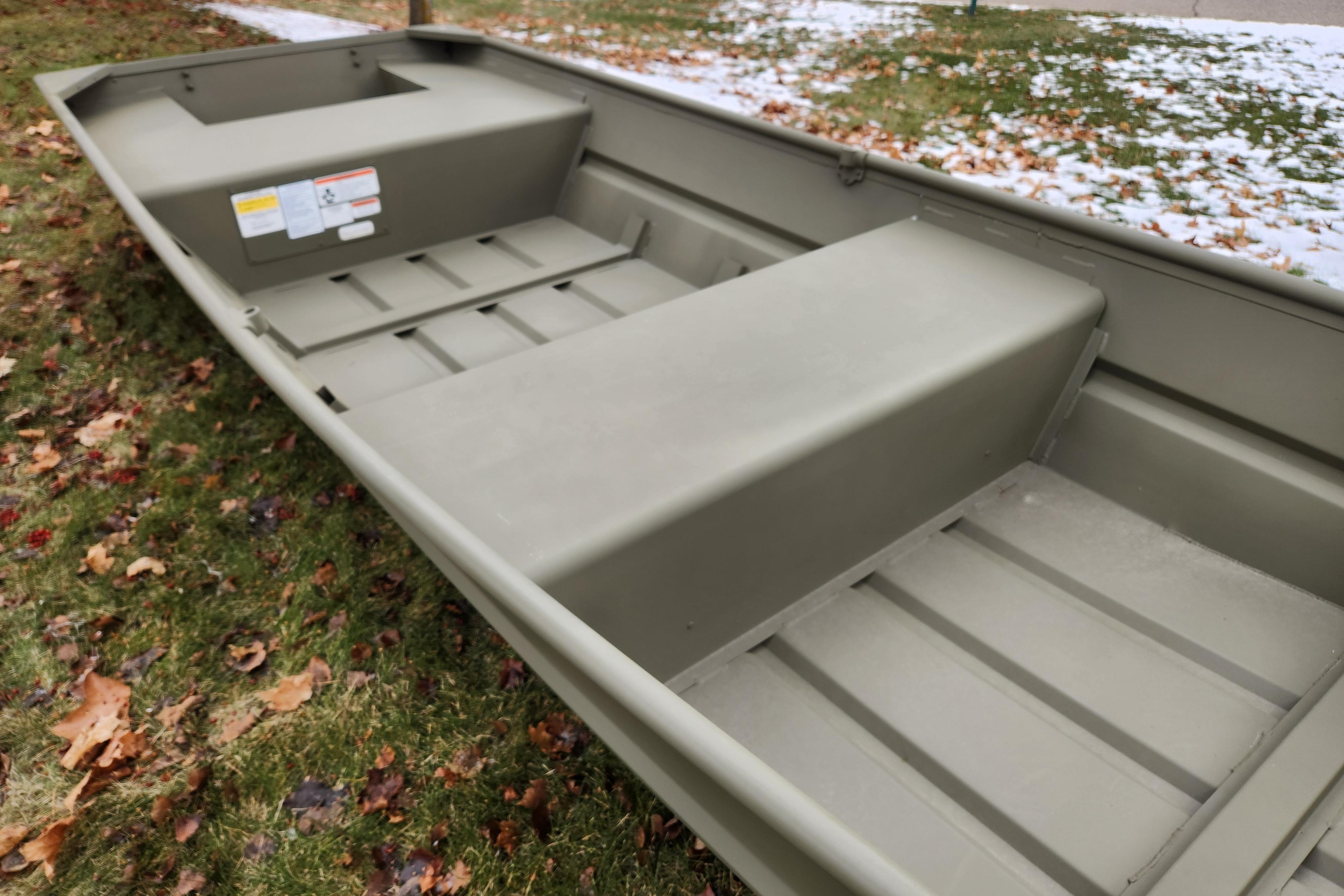 2026 Tracker Grizzly 14 Jon boat on grass with autumn leaves.
