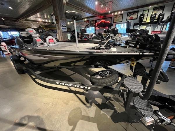 2025 Tracker Savage 215 boat displayed indoors with modern fishing equipment.