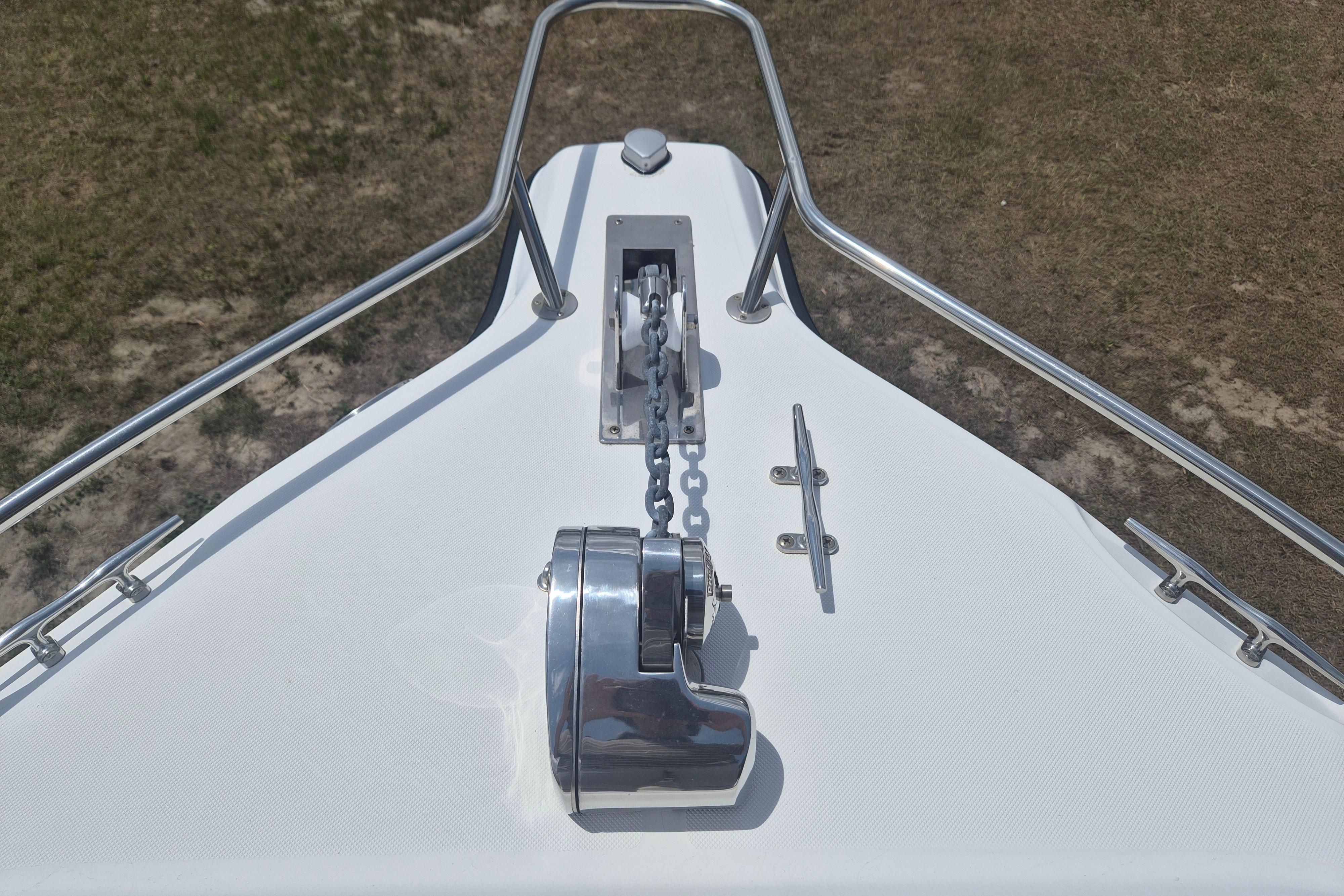 Bow of 2006 Century 2900 Center Console with anchor chain and cleat.