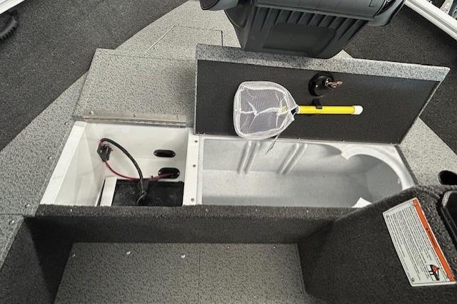 2026 Lund 1650 Rebel XL SS boat interior with storage compartments and fishing net.