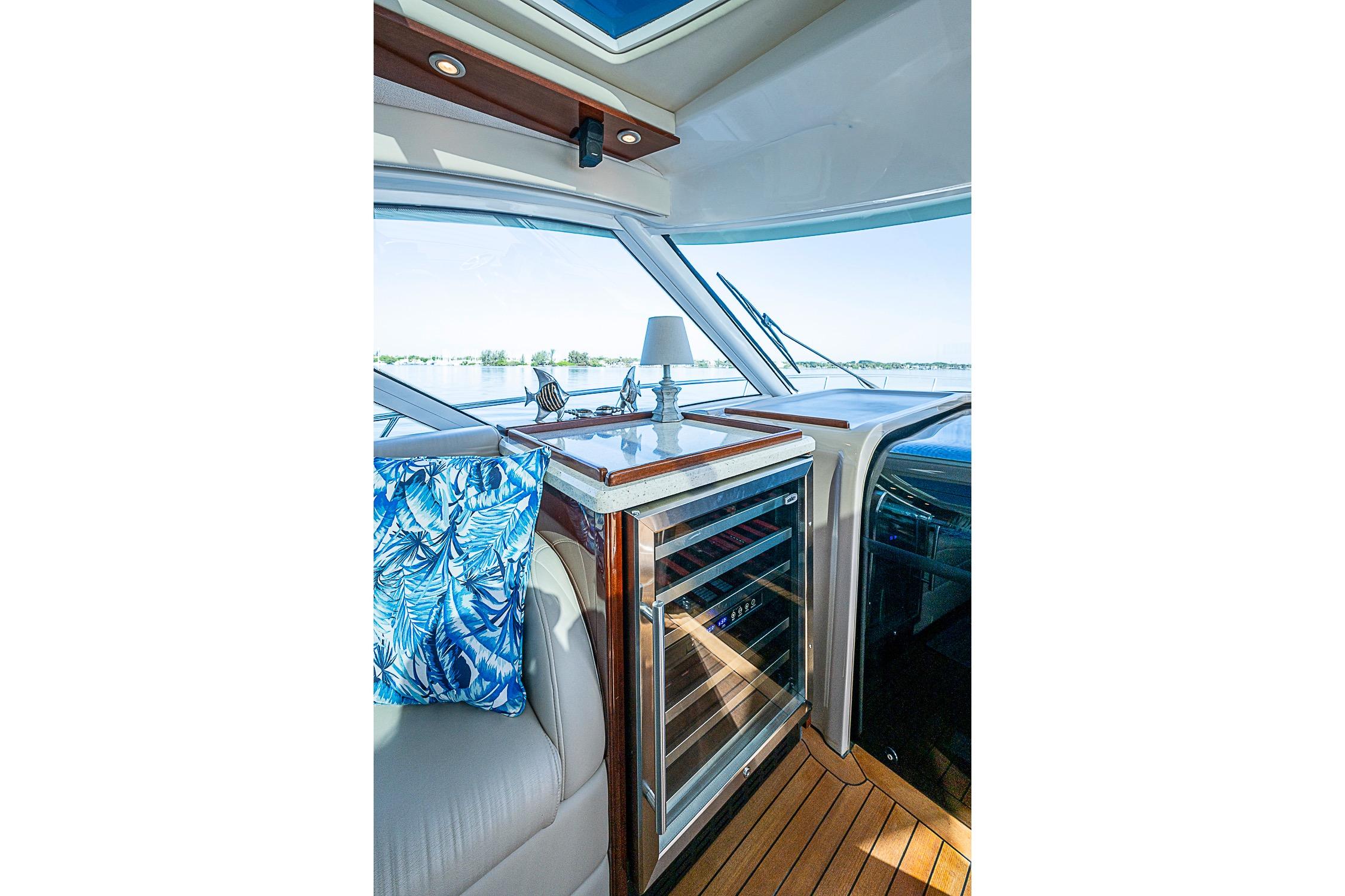 Interior of 2008 Sea Ray 60 Sundancer yacht with wine cooler and scenic view.