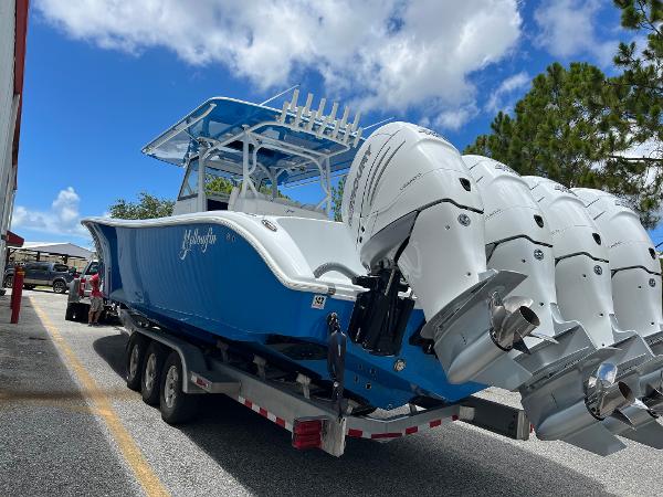 2022 Yellowfin 39 Offshore boat with triple outboard engines on a trailer.