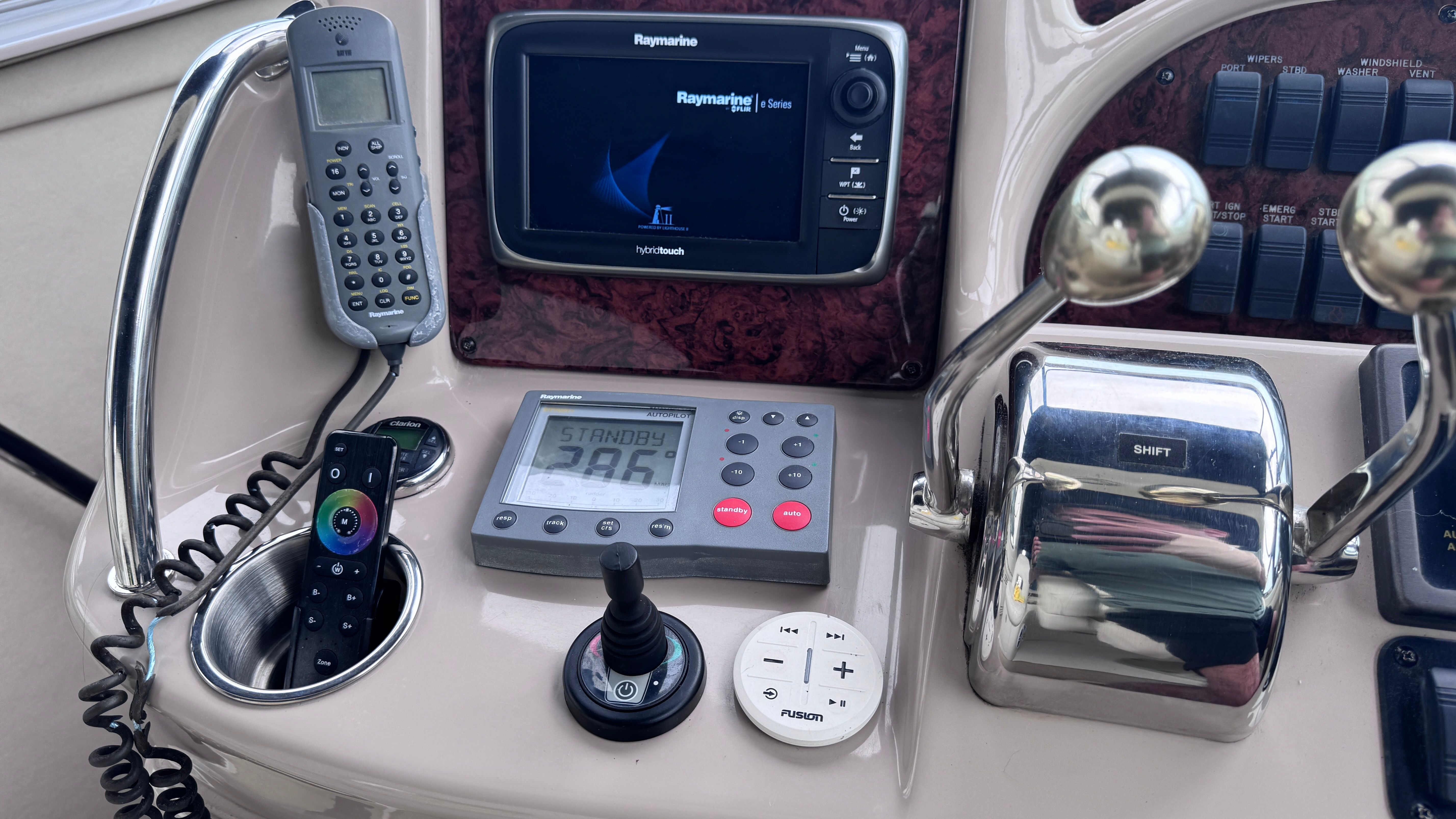 The image shows the dashboard of a 2003 Sea Ray 360 Sundancer with various navigation equipment.