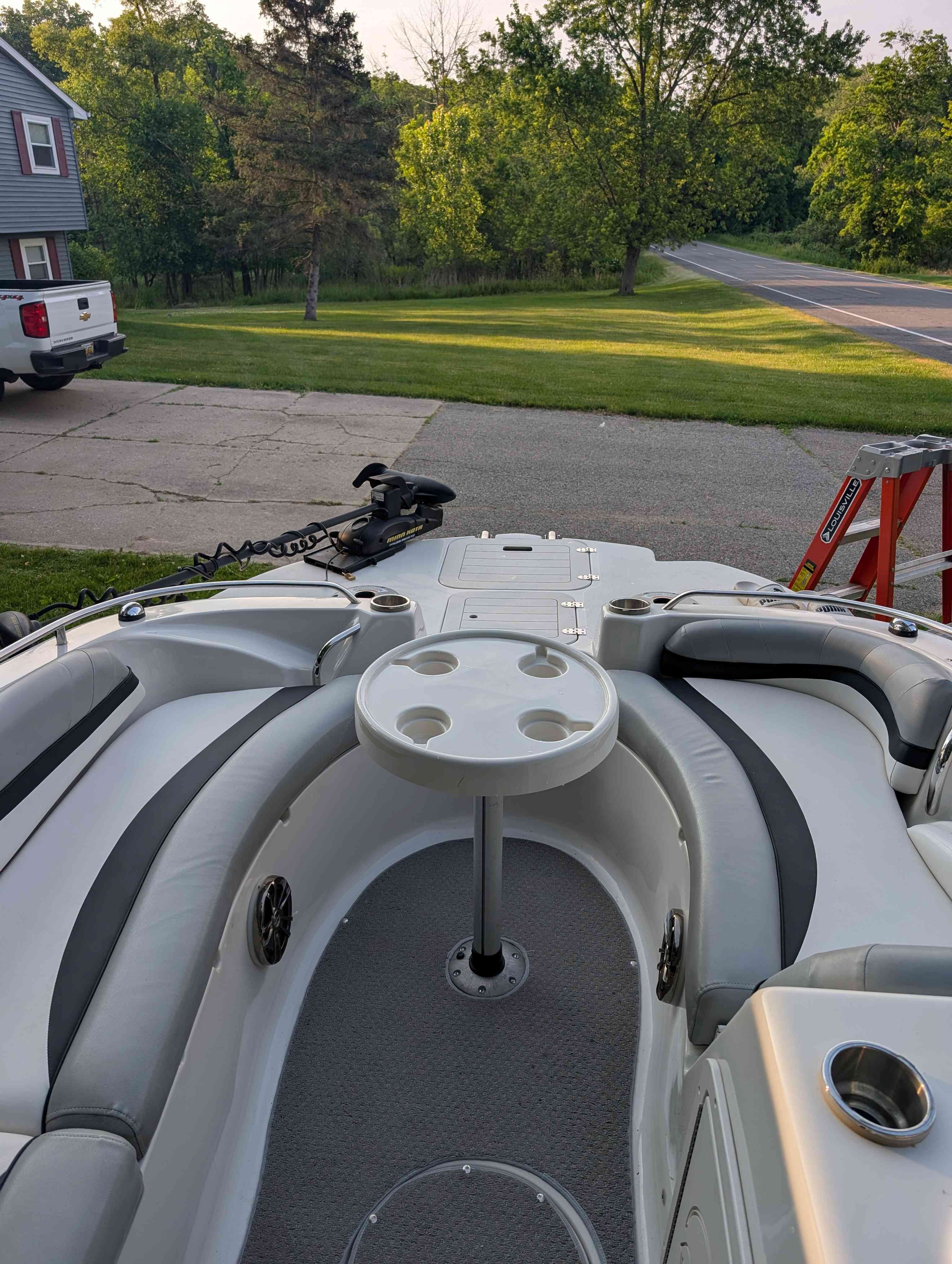 Interior of a 2015 Starcraft 2000 boat parked on driveway.