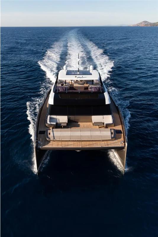 2026 Sunreef 80 Sunreef Power yacht cruising on open sea, aerial view.