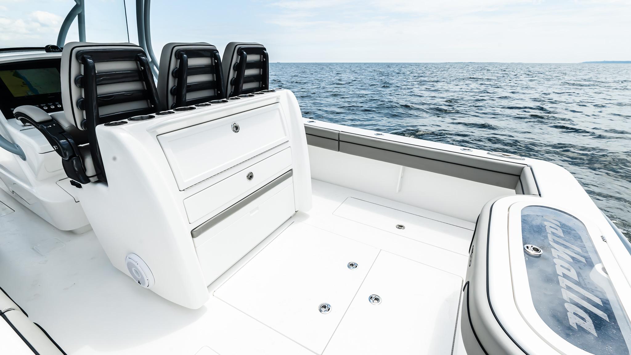 2025 Valhalla Boatworks V-33, sleek design, spacious deck, ocean backdrop.