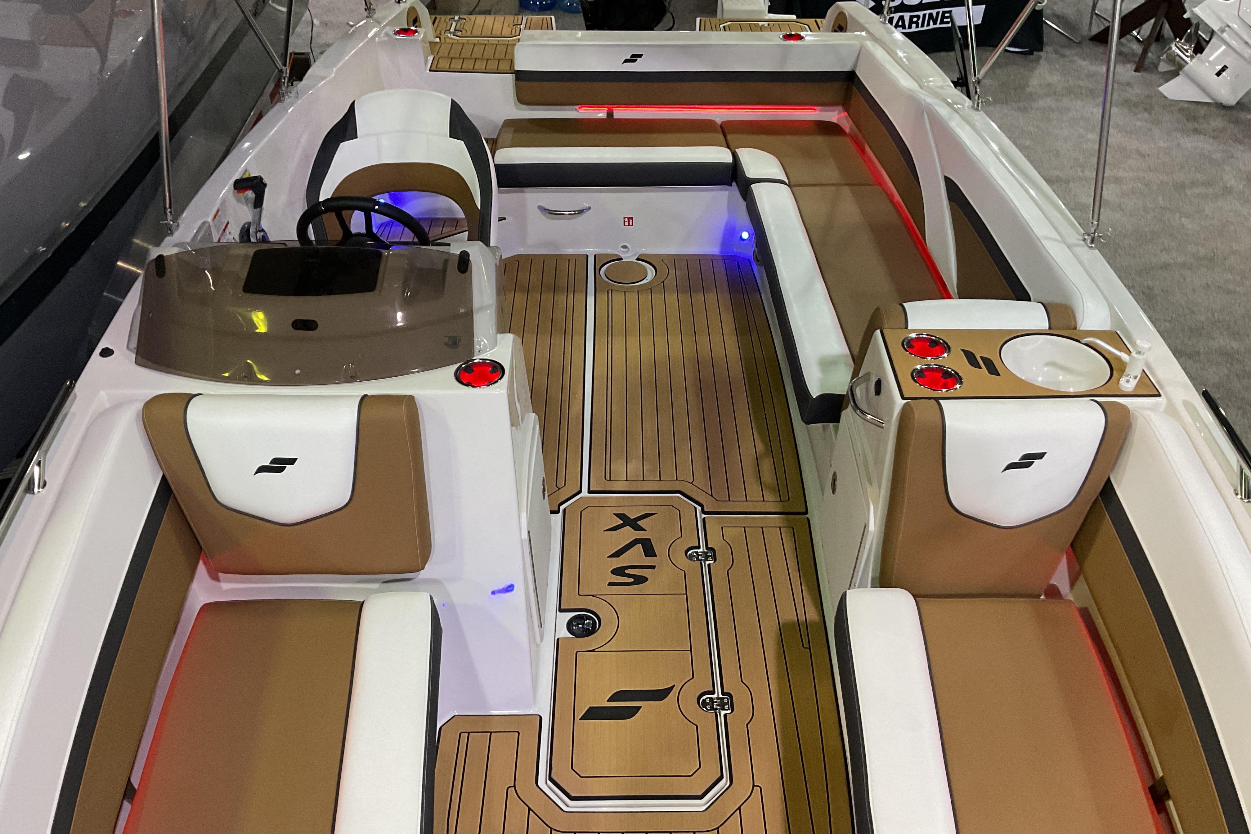 2026 Starcraft SVX 211 OB boat interior with tan and white seating, modern design.