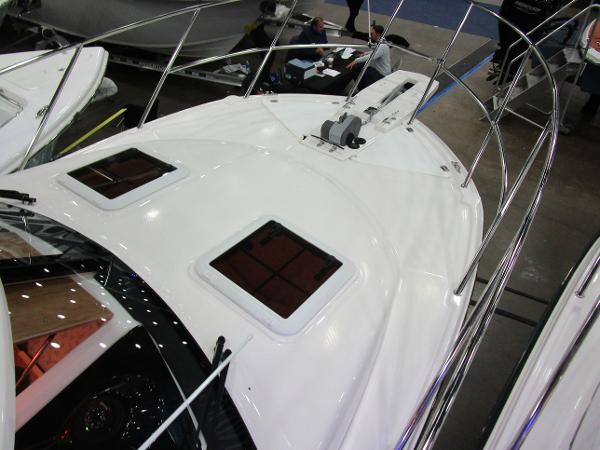 2025 Cutwater C-248 Coupe boat deck with sleek design and dual hatches.