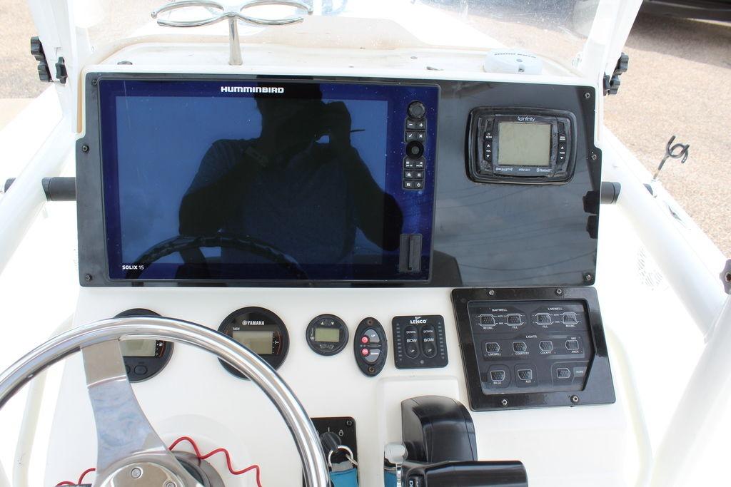 Dashboard of 2026 Skeeter SX230 boat with Humminbird electronics and steering wheel.