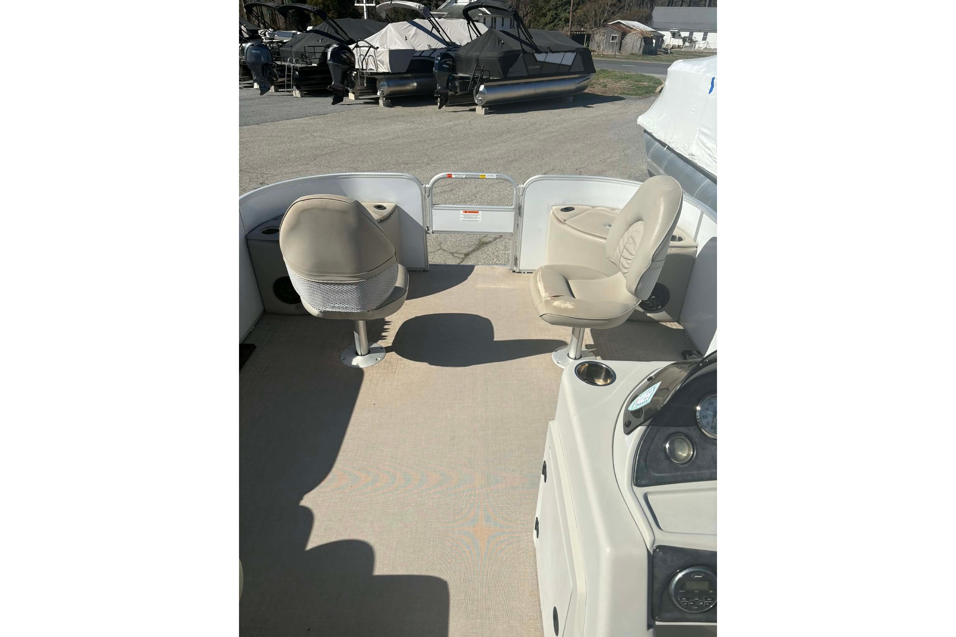 2017 G3 boat interior with beige seating and control panel.