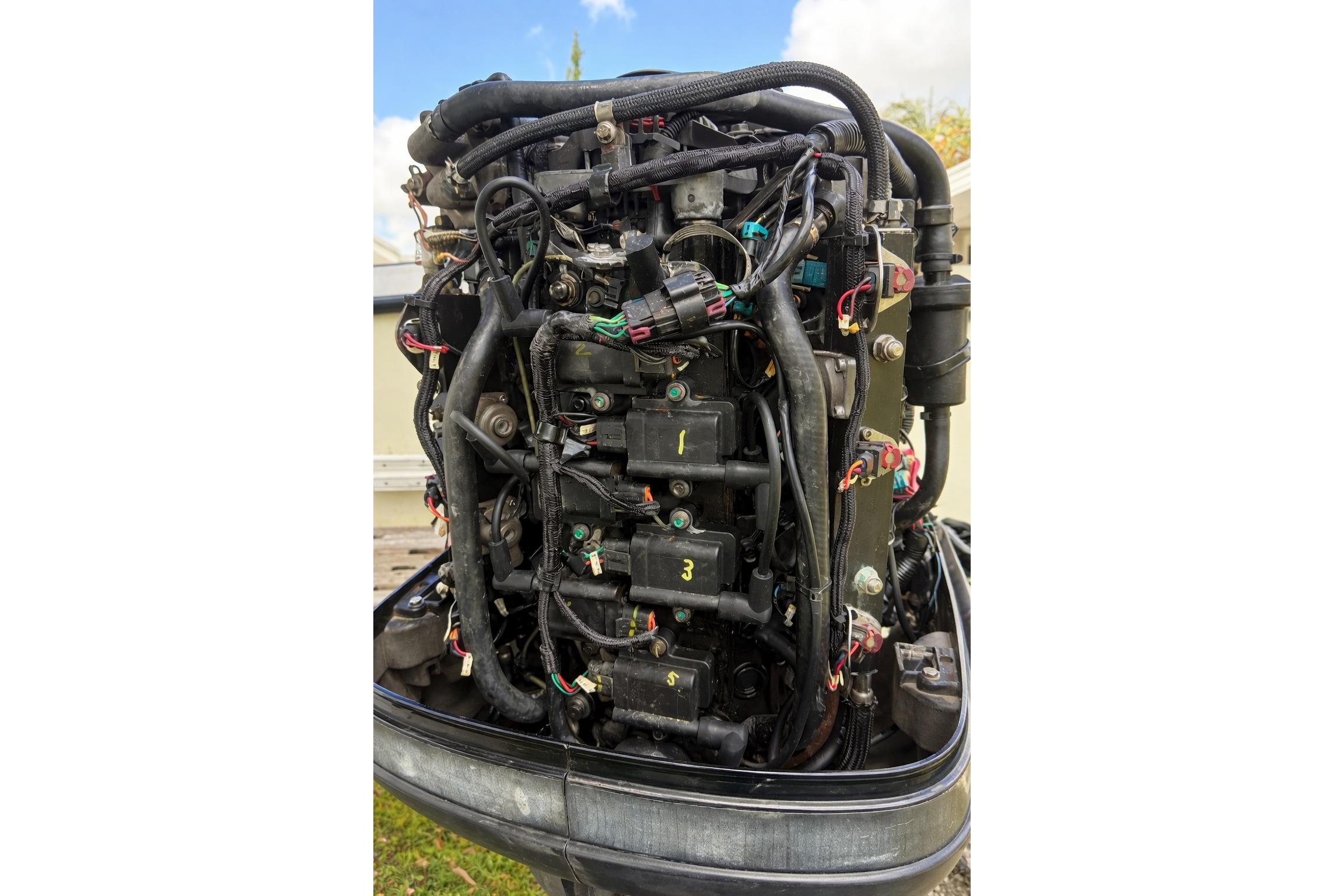 1989 Grady-White Offshore 242 boat engine with visible wiring and components.