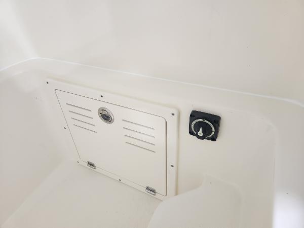 2025 Pathfinder 2400 Open boat interior compartment and control panel.