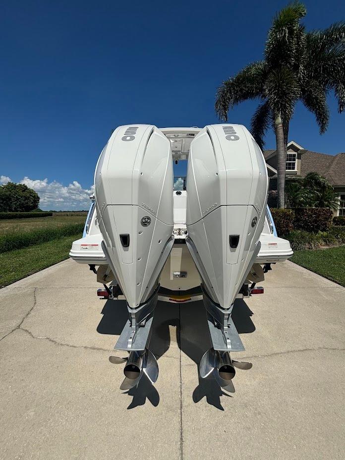 Rear view of 2021 Blackfin 272 DC with twin outboard engines.