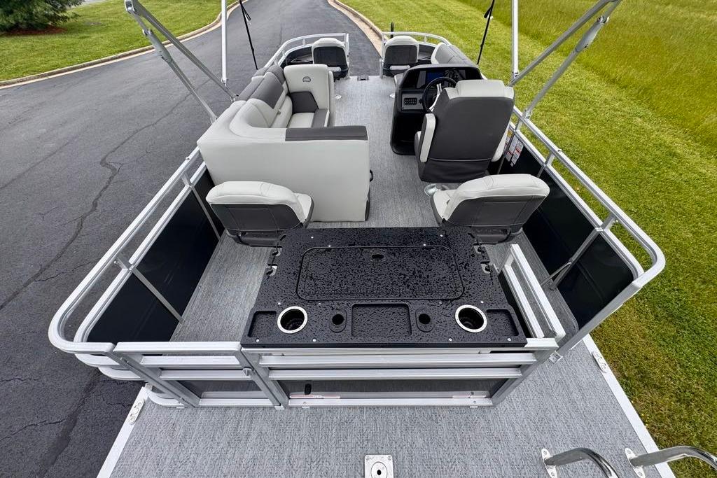 2026 Sun Tracker Fishin' Barge 20 DLX pontoon boat with spacious seating and fishing amenities.