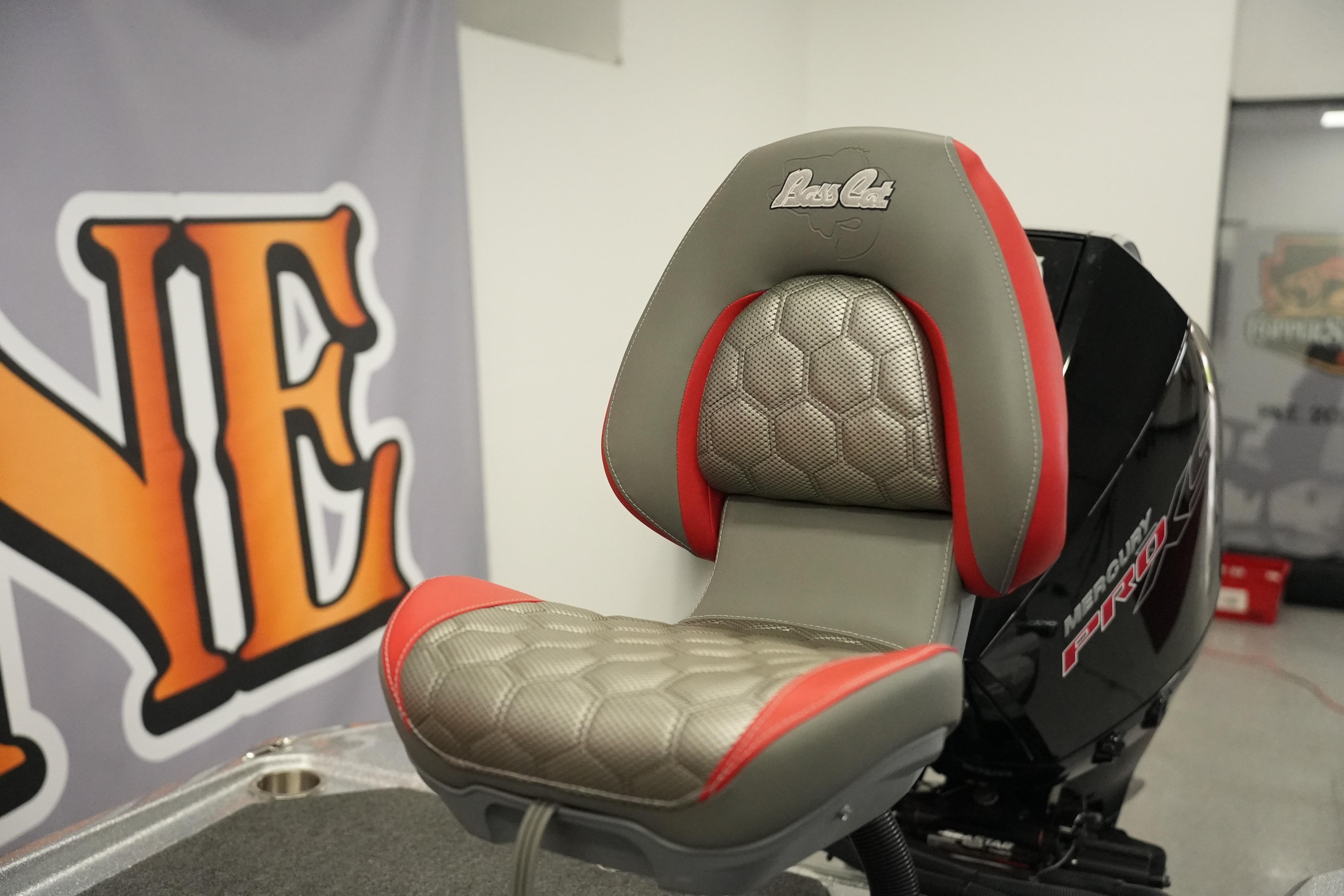 2026 Bass Cat Lynx STS boat seat with red accents and textured upholstery.