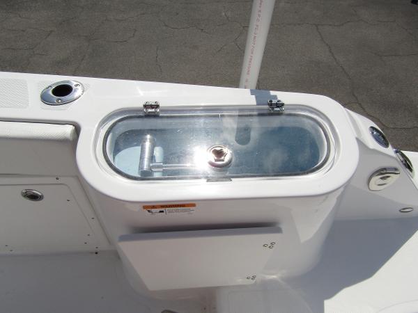 2024 Wellcraft 263 Fisherman livewell with clear lid and rod holders.