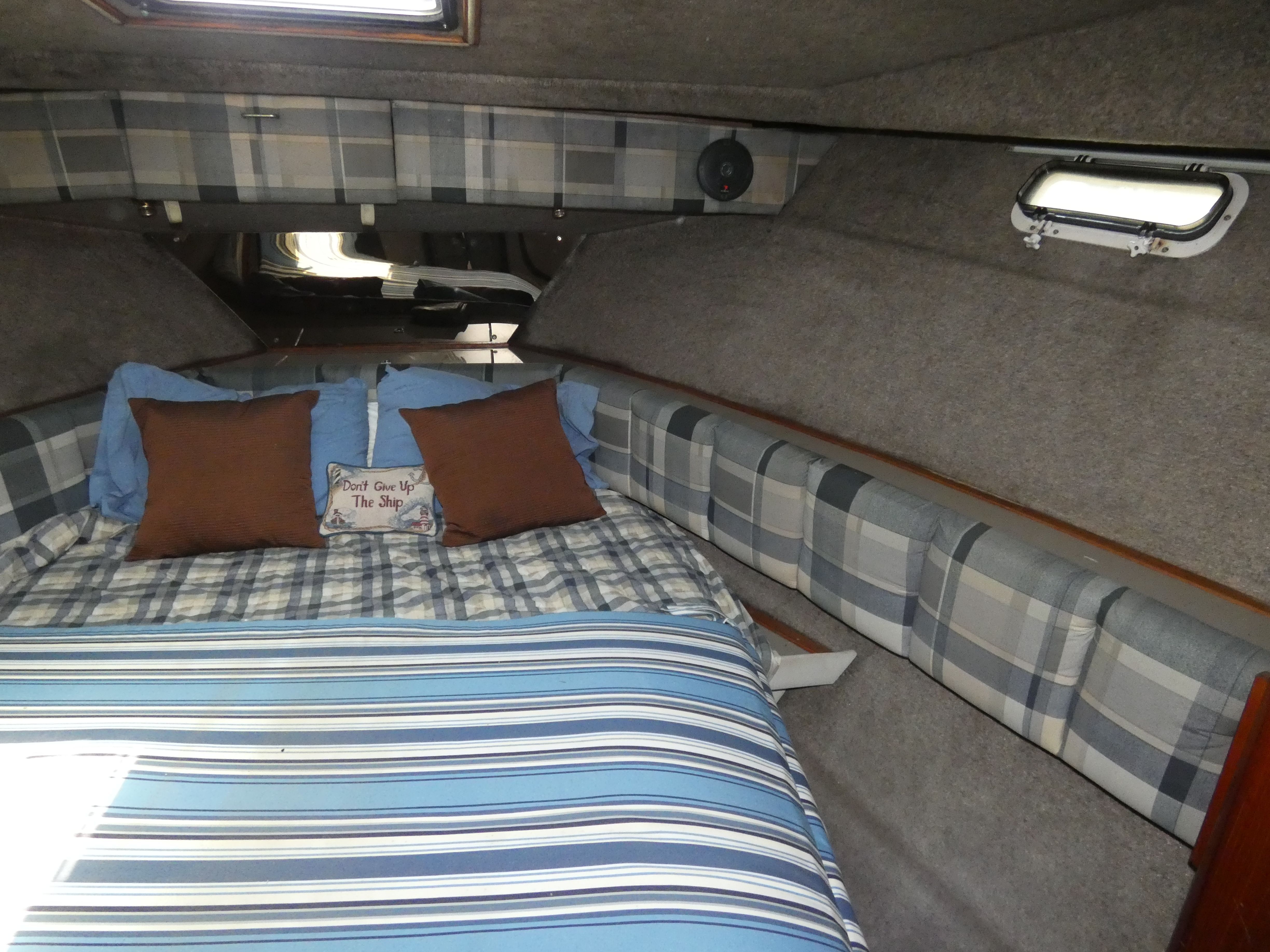 Interior of 1984 Bayliner 3870 Motoryacht with cozy bed.