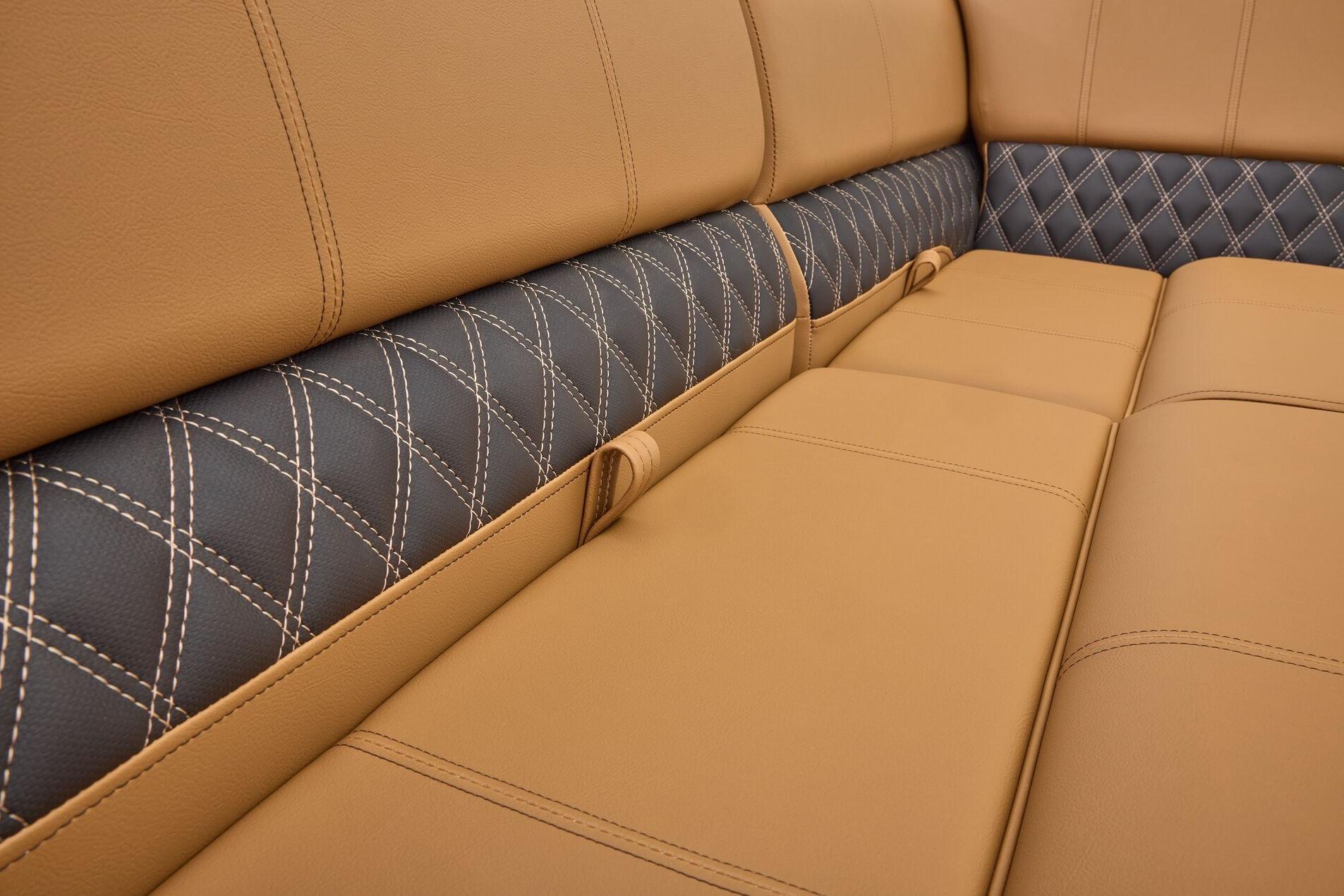 Luxurious tan and black leather seating in 2026 Ranger 223FC with diamond stitching.