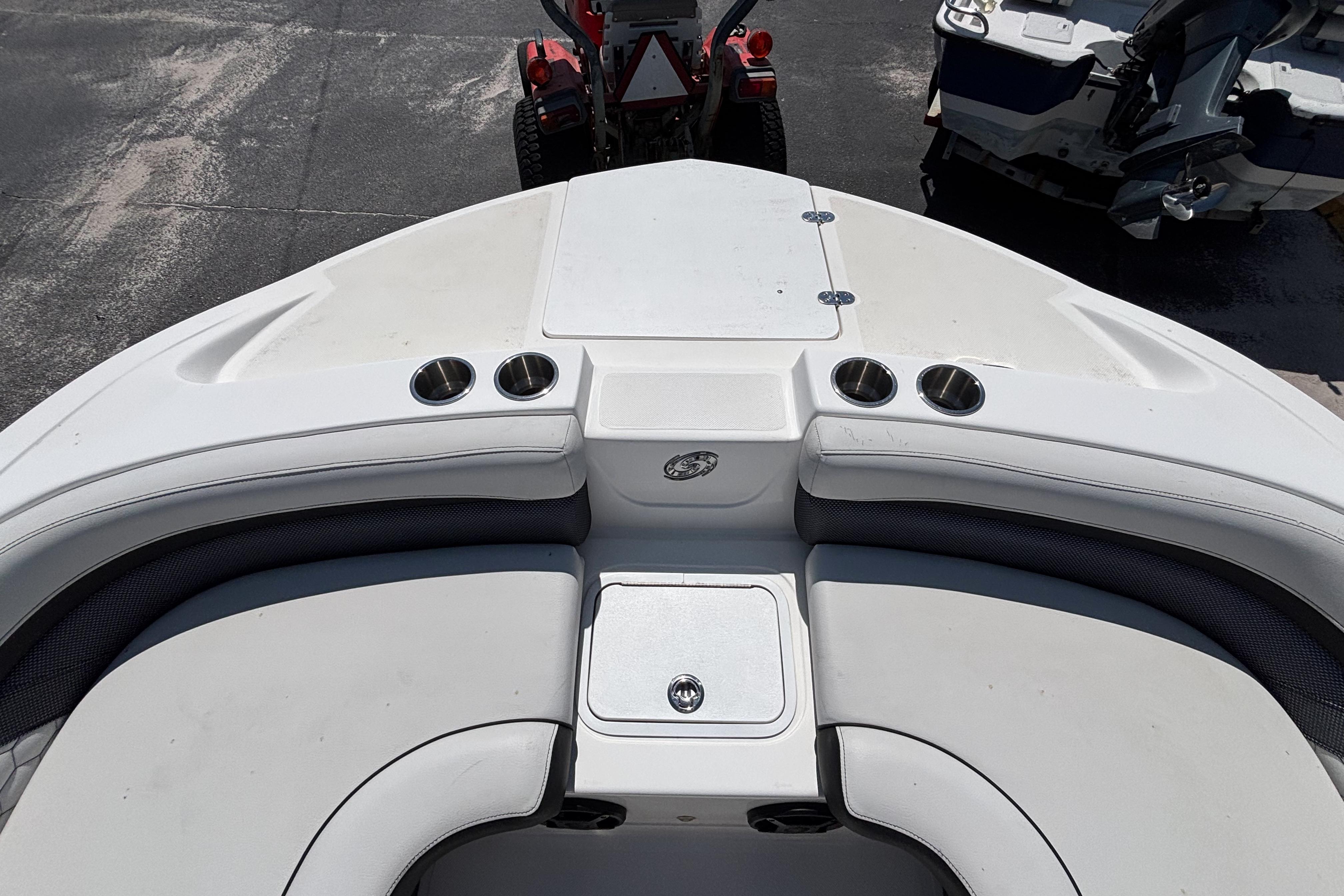 2019 Hurricane Sundeck Sport 218 OB boat interior with seating and cup holders.