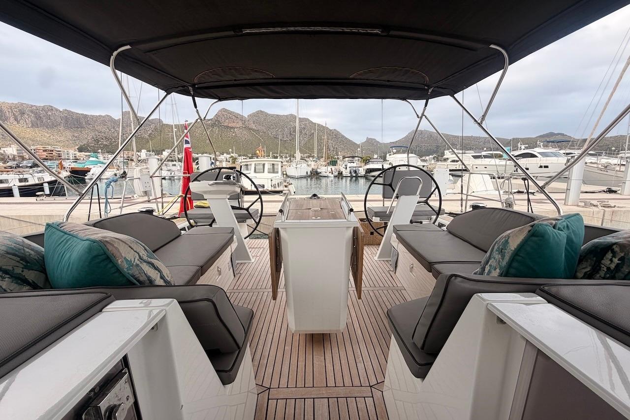 Luxurious 2021 Beneteau Oceanis 51.1 yacht interior with elegant seating and marina view.