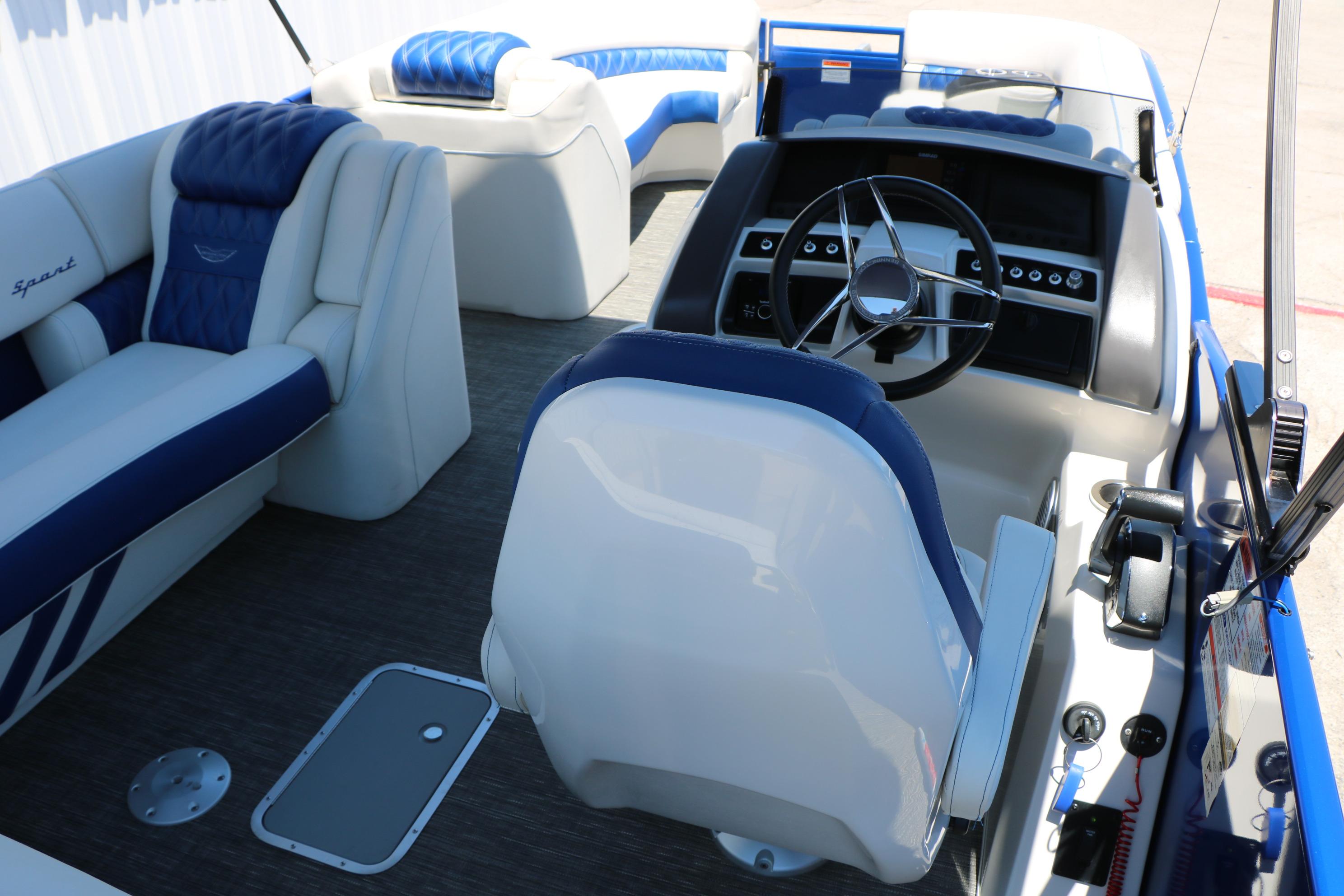 2024 Bennington 23 RX Swingback boat interior with plush seating and modern helm controls.