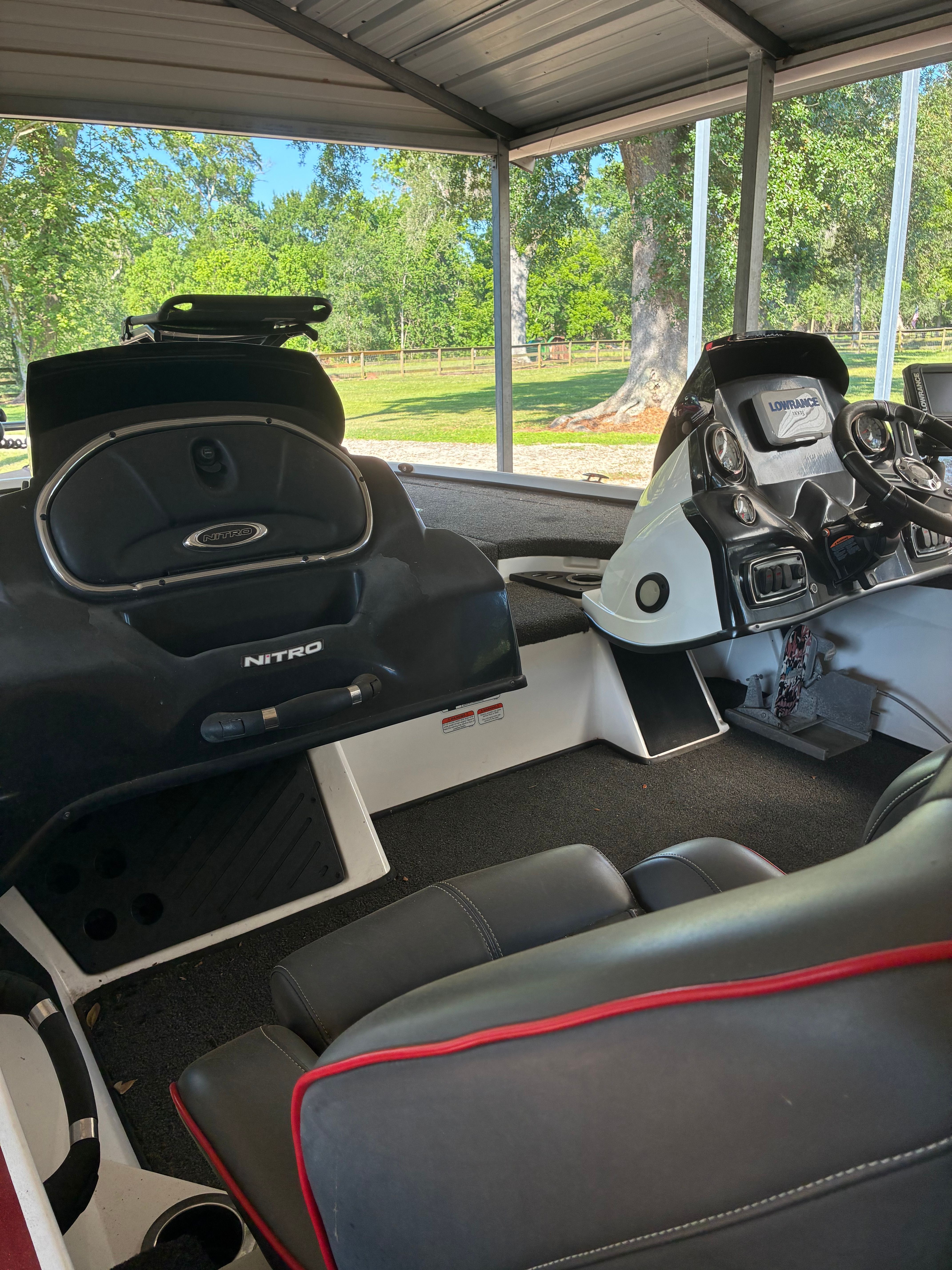 Interior view of a Nitro Z18 boat under a shelter.