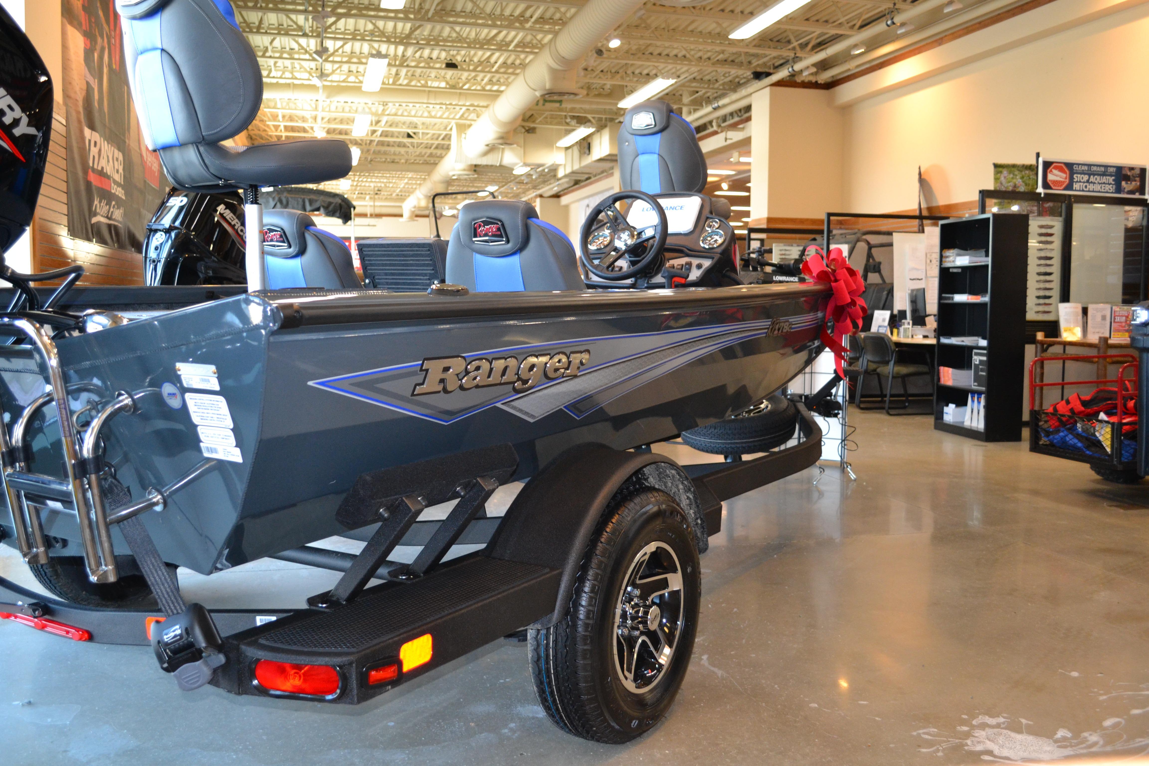 2026 Ranger RT178C boat displayed indoors, featuring sleek design and modern seating.