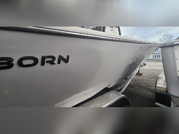 2023 Sea Born LX22 Center Console boat side view on trailer.
