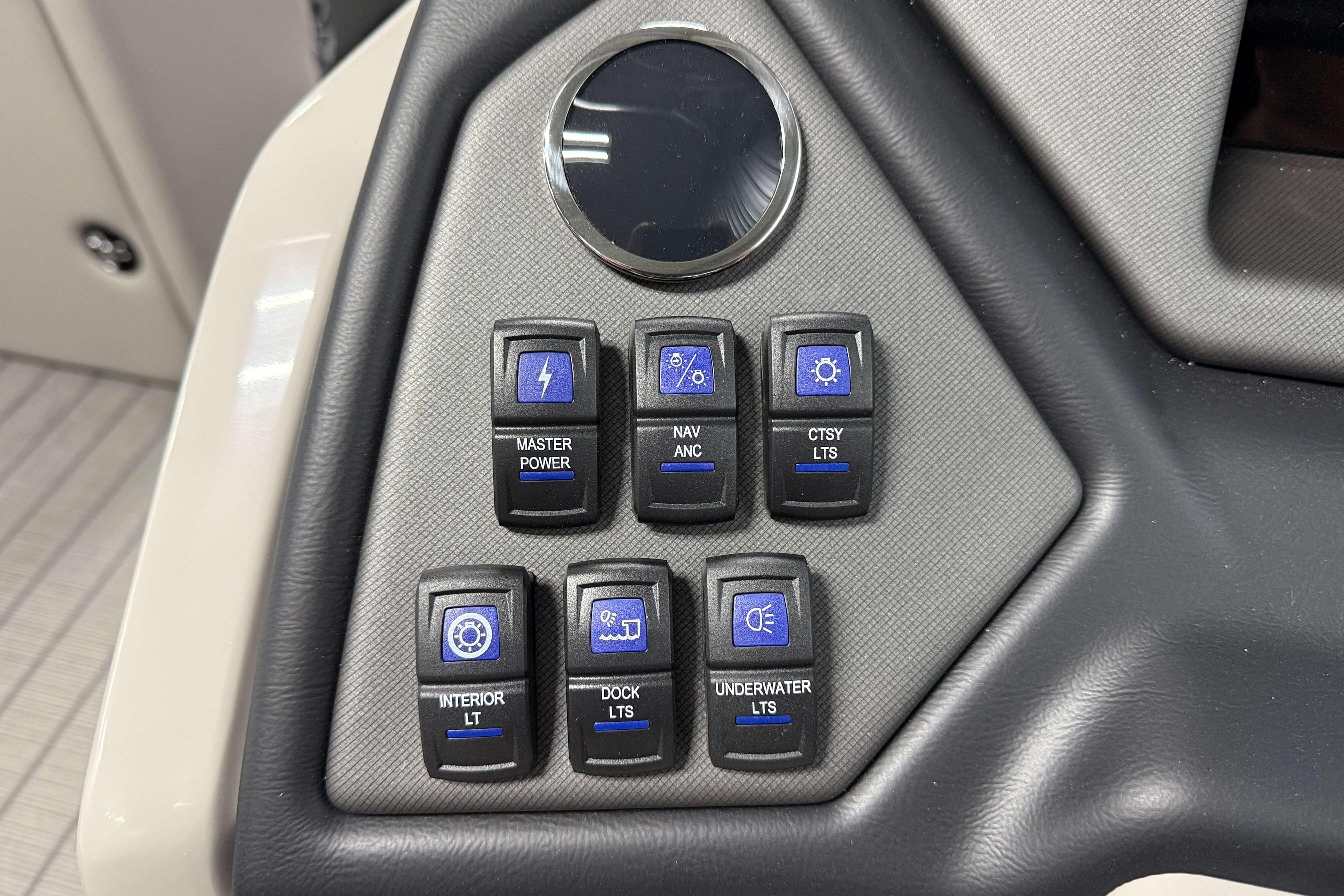 Control panel of 2026 Sylvan L3 SLZ boat with various function switches.