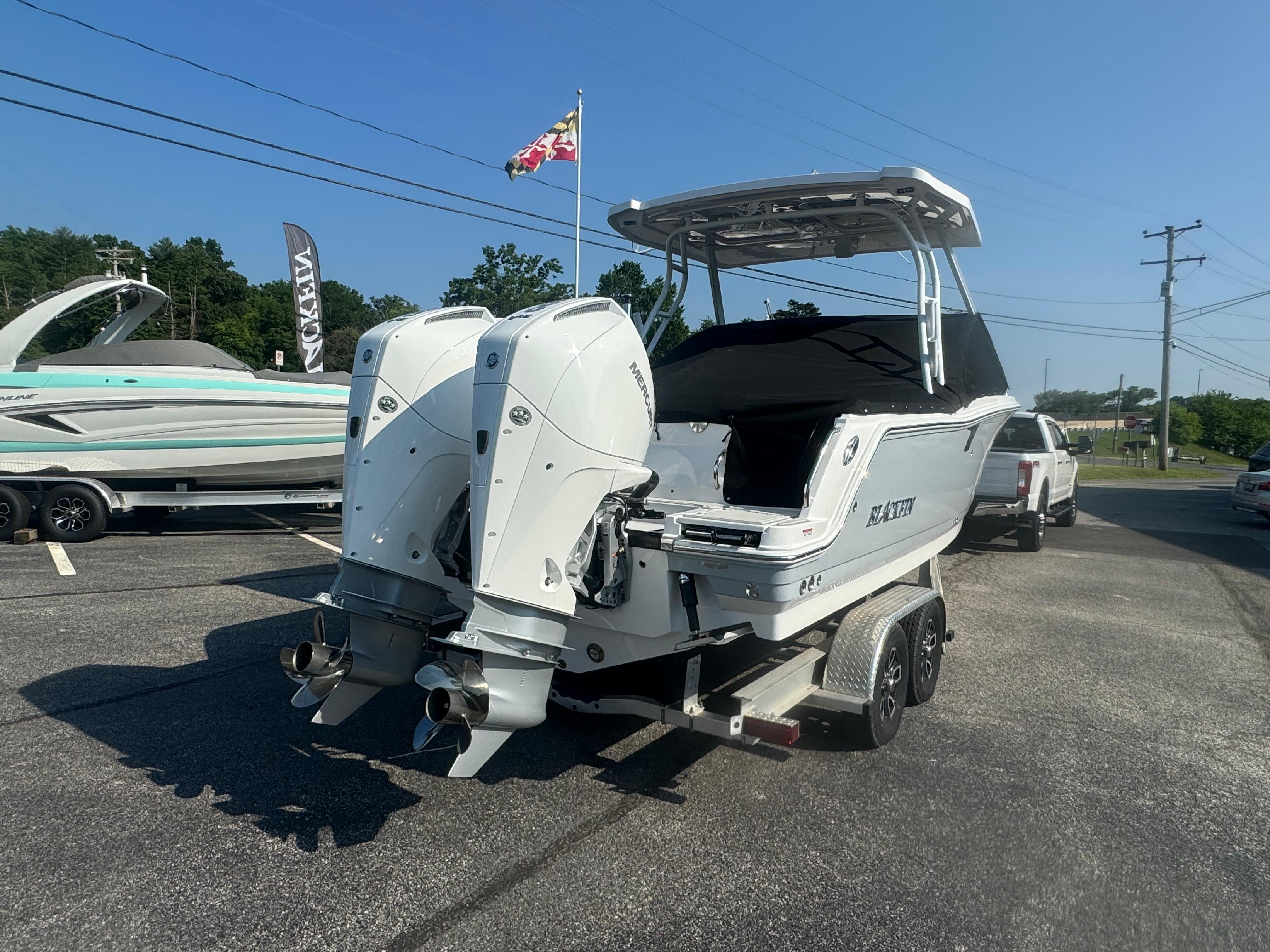 2025 Blackfin 252 DC boat with dual outboard engines on a trailer.