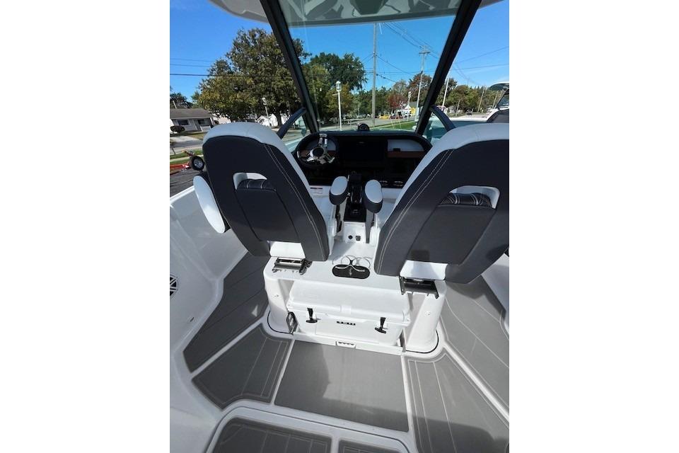 Interior view of 2026 Monterey Elite 27 SD boat, featuring modern seating and controls.