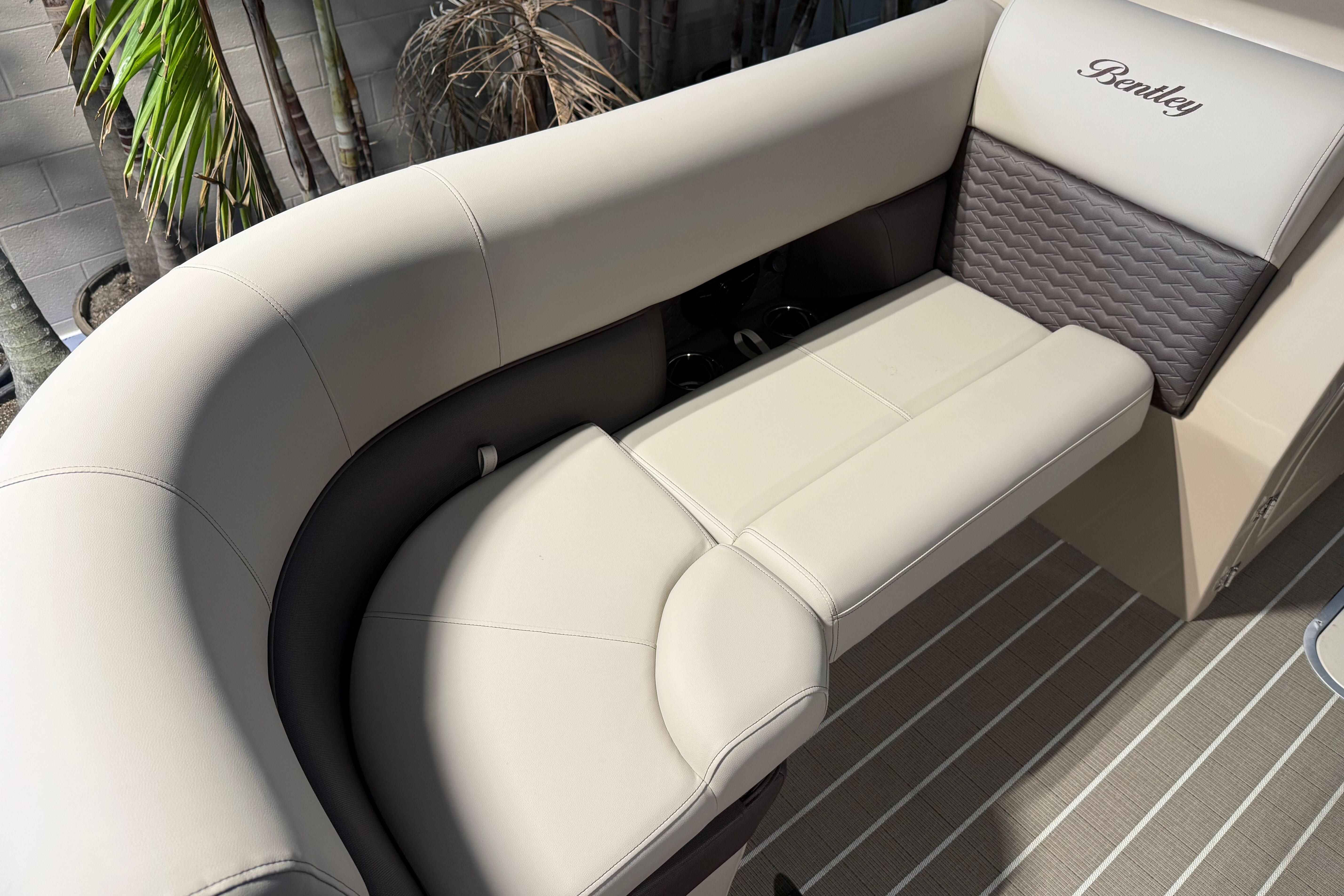 Luxurious seating on 2026 Bentley Pontoons Elite 223 Admiral, featuring elegant beige upholstery.