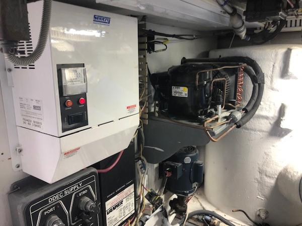 1997 Bertram Convertible engine room with electrical and mechanical components.