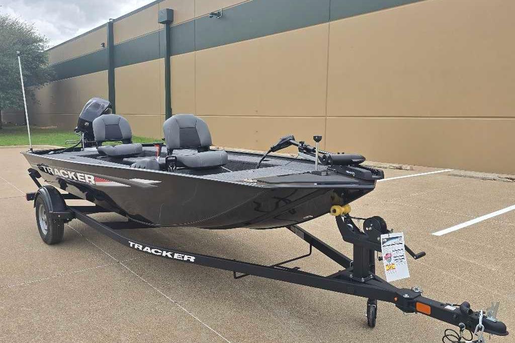 2026 Tracker Panfish 17 fishing boat on trailer, parked outdoors.