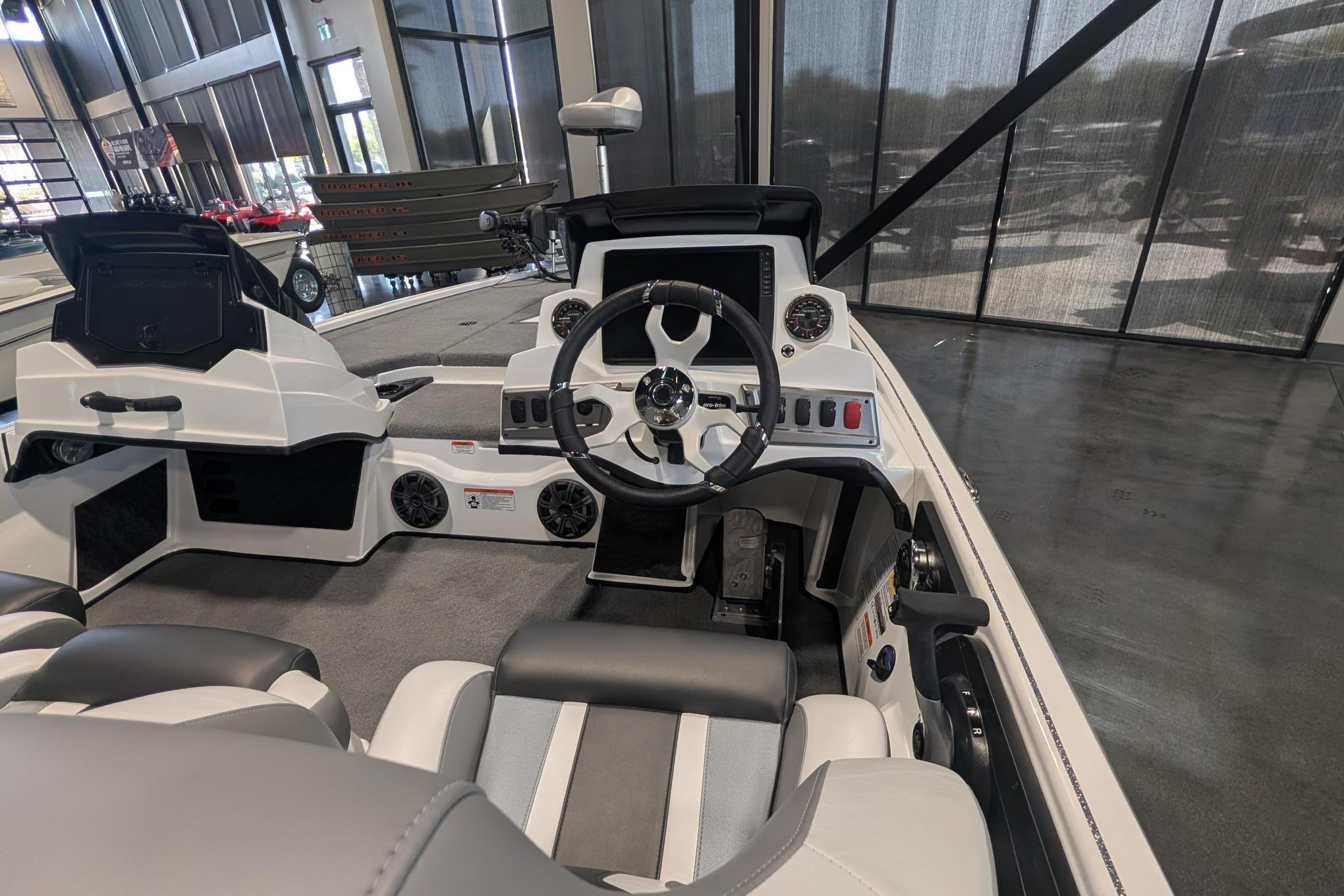 2026 Nitro Z19 XL Pro boat interior with steering wheel and control panel.