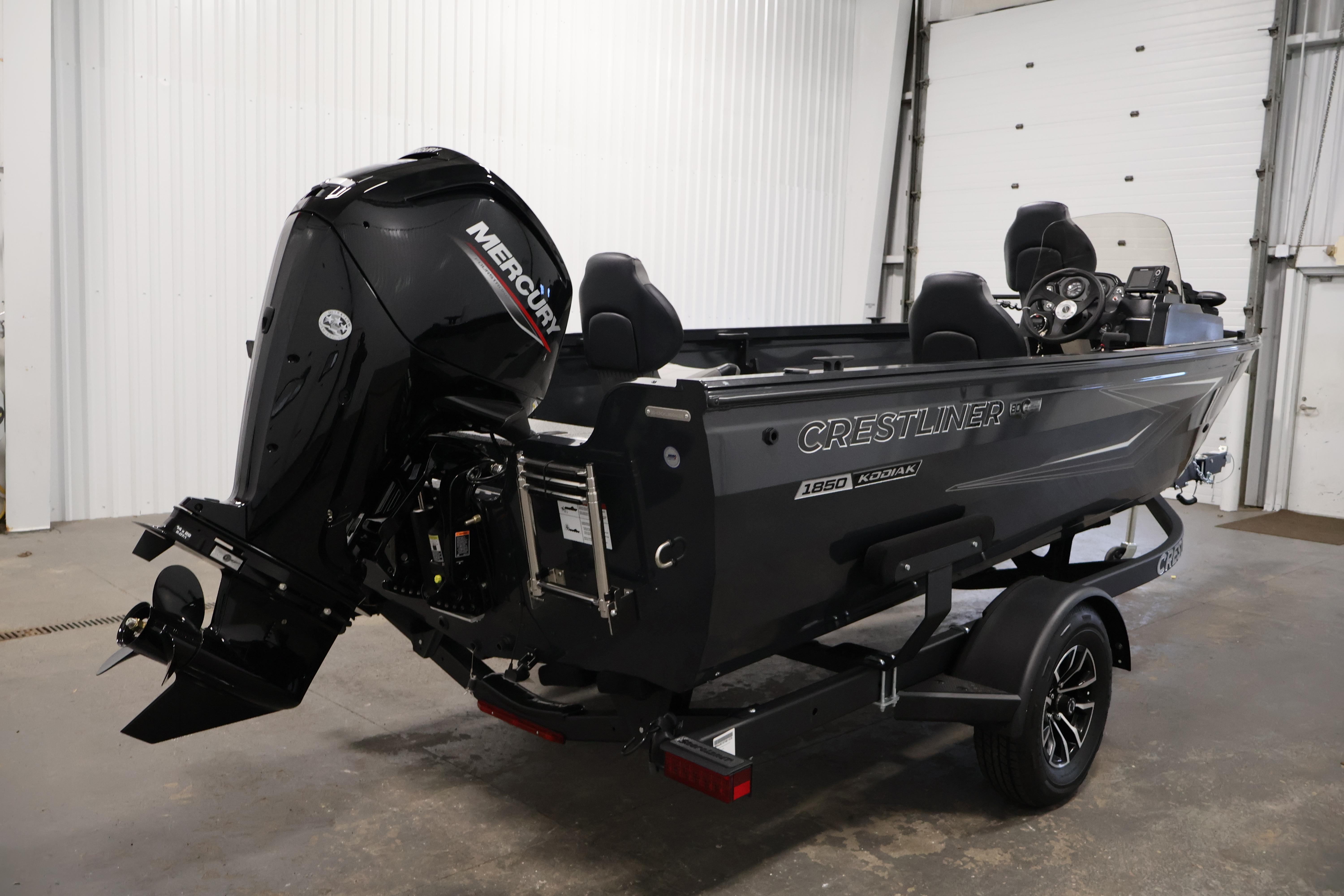 2026 Crestliner 1850 Kodiak SC boat with Mercury engine in a garage setting.