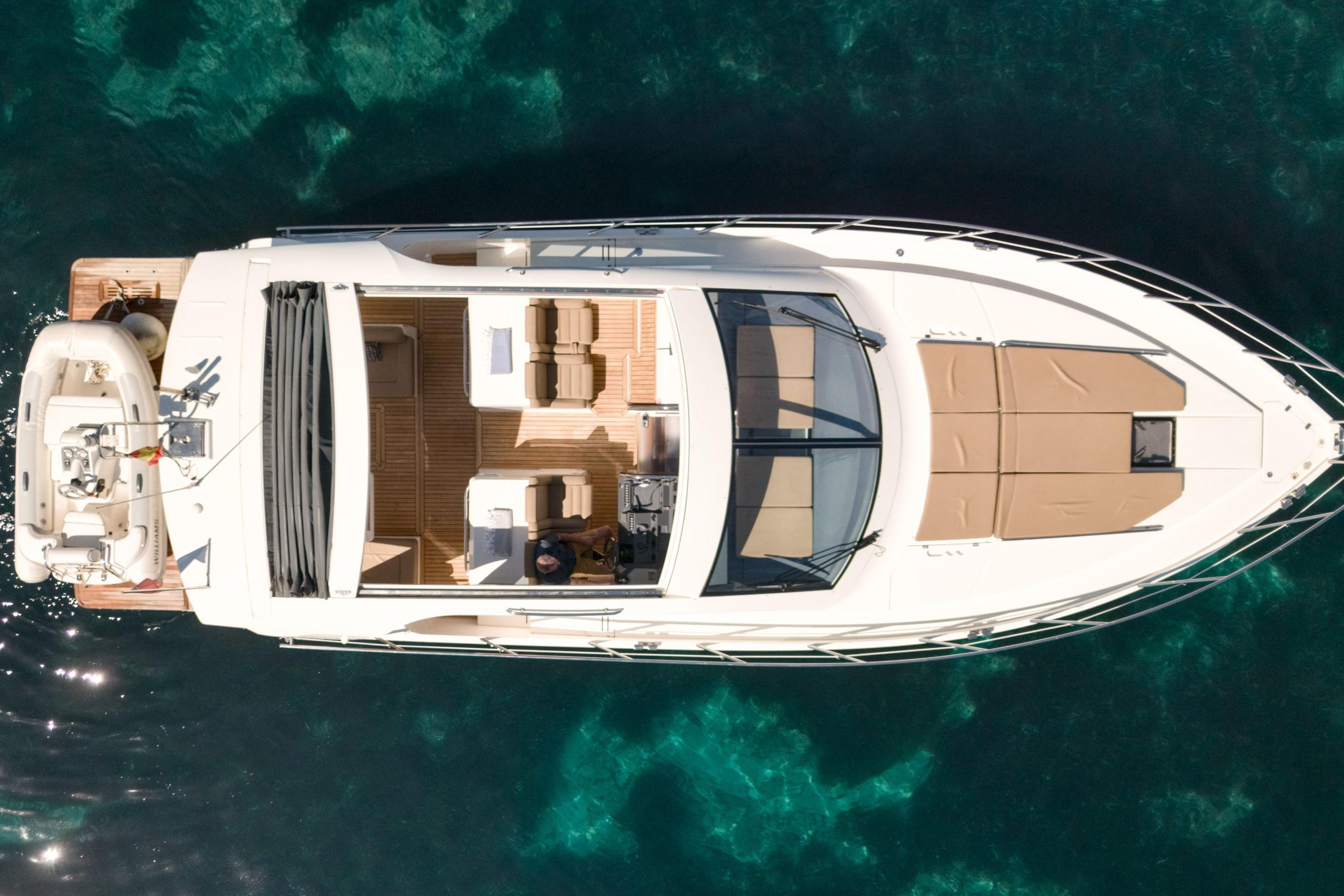 Overhead view of 2012 Sealine SC42 yacht on clear blue water.
