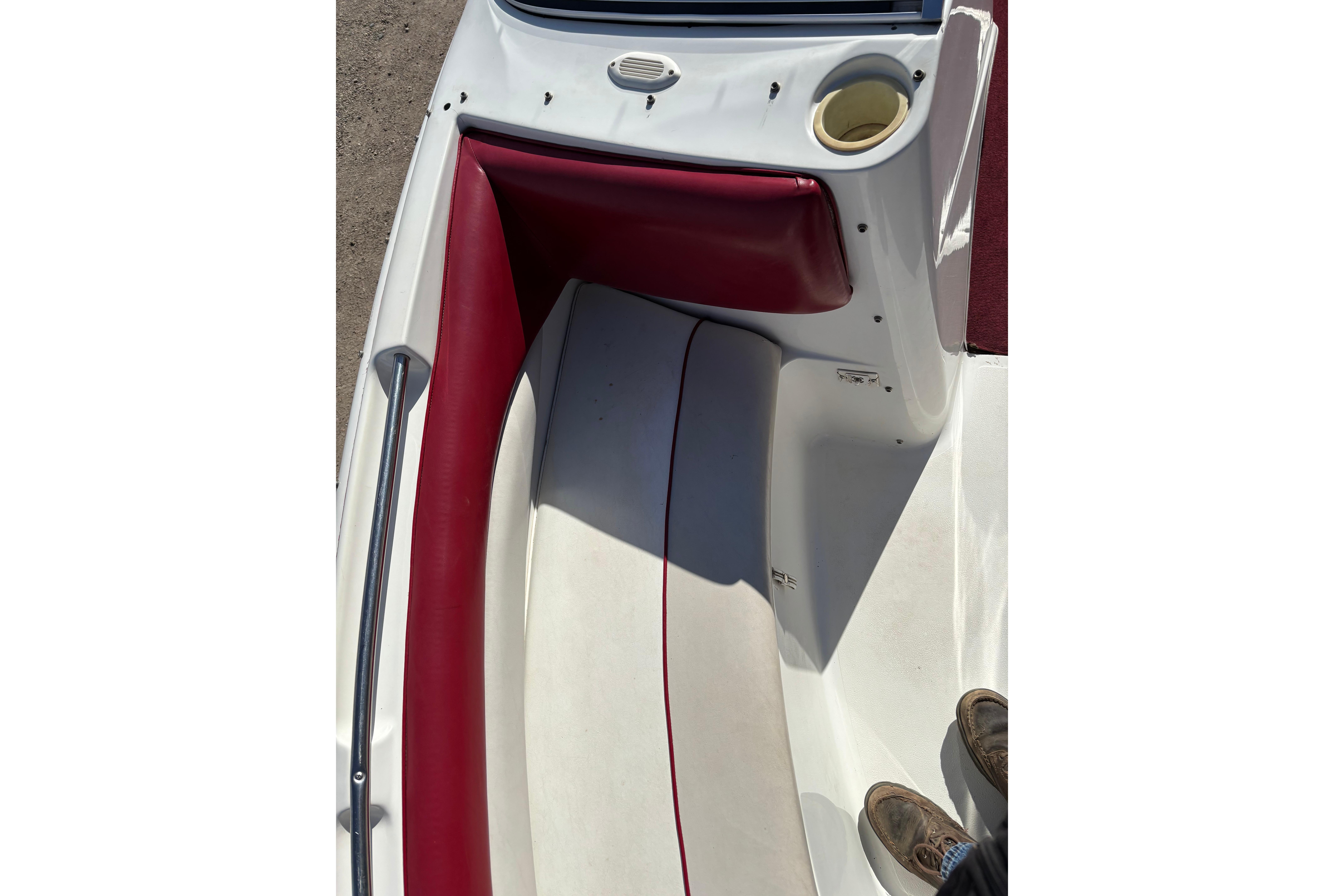 1993 Larson SEi 200 Cuddy I/O boat interior with red and white seating.