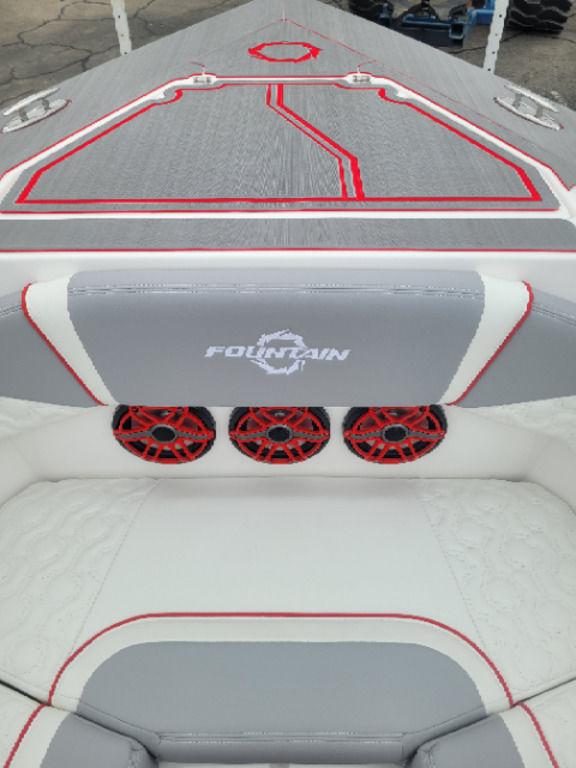 2024 Fountain 38 SCX boat interior with red accents and audio system.