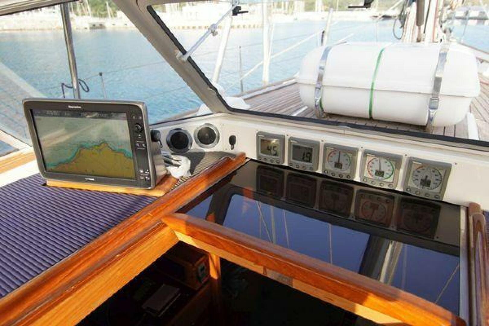 Navigation instruments on a 2002 Hallberg-Rassy 53 yacht, featuring a GPS display and gauges.