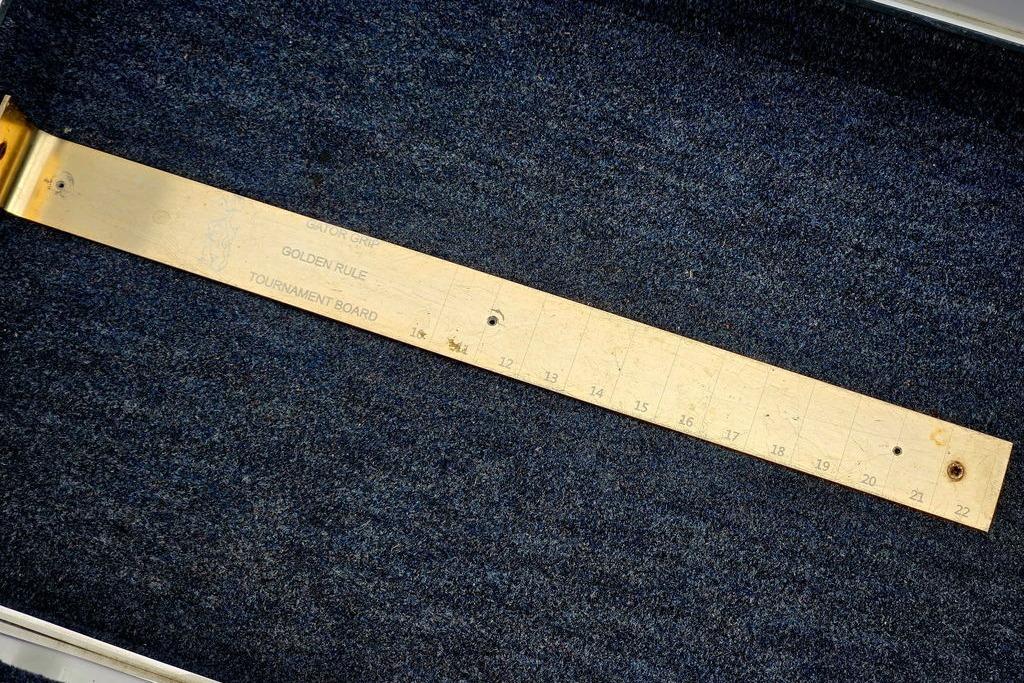 Golden Rule tournament measuring board on dark carpet, Champion 181 SX, 1996 model.