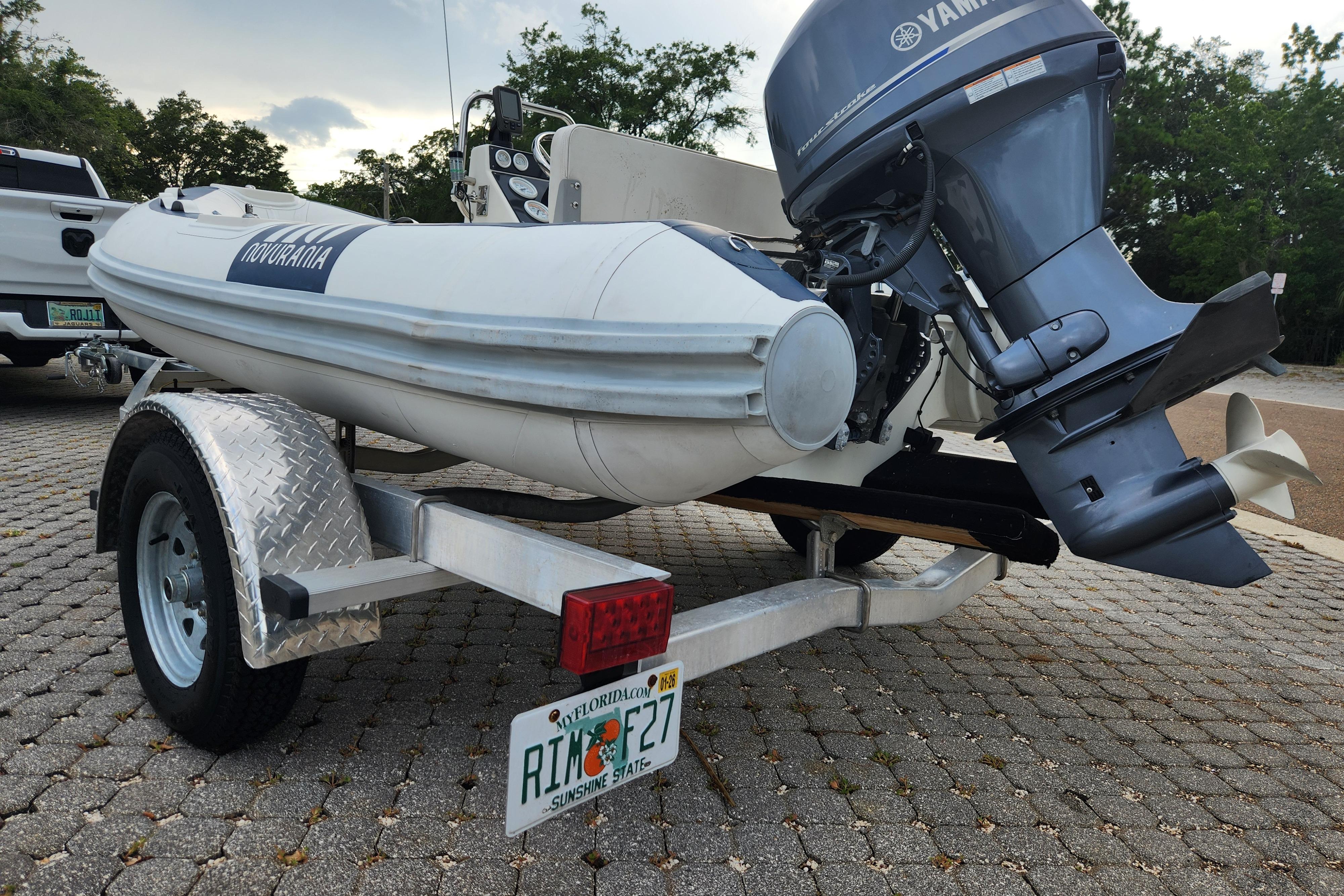 2019 Novurania DL 400 boat on trailer with Yamaha outboard motor, parked outdoors.