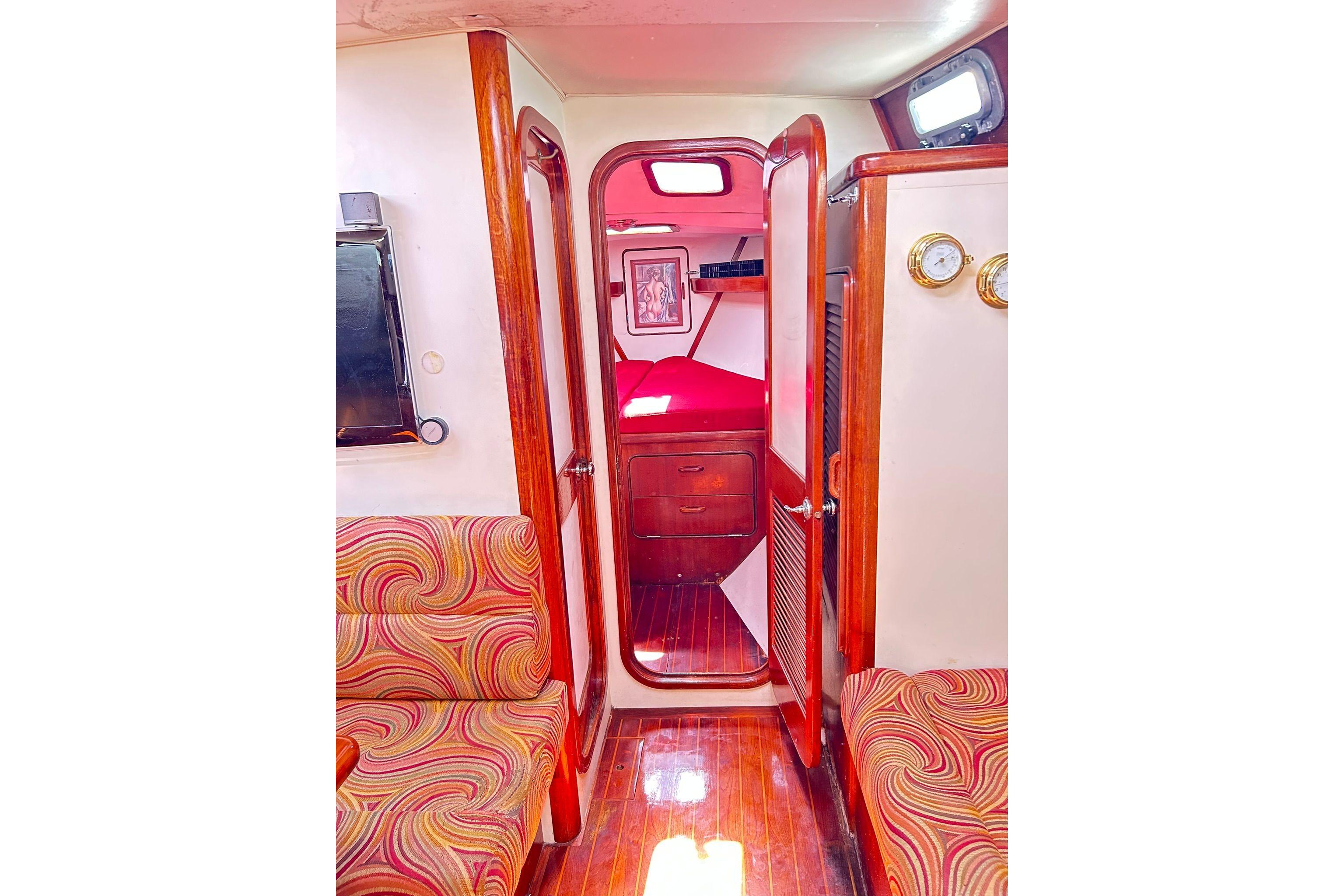 Interior of 1987 Gulfstar CSY 50 Pilot House with vibrant upholstery and wooden finishes.