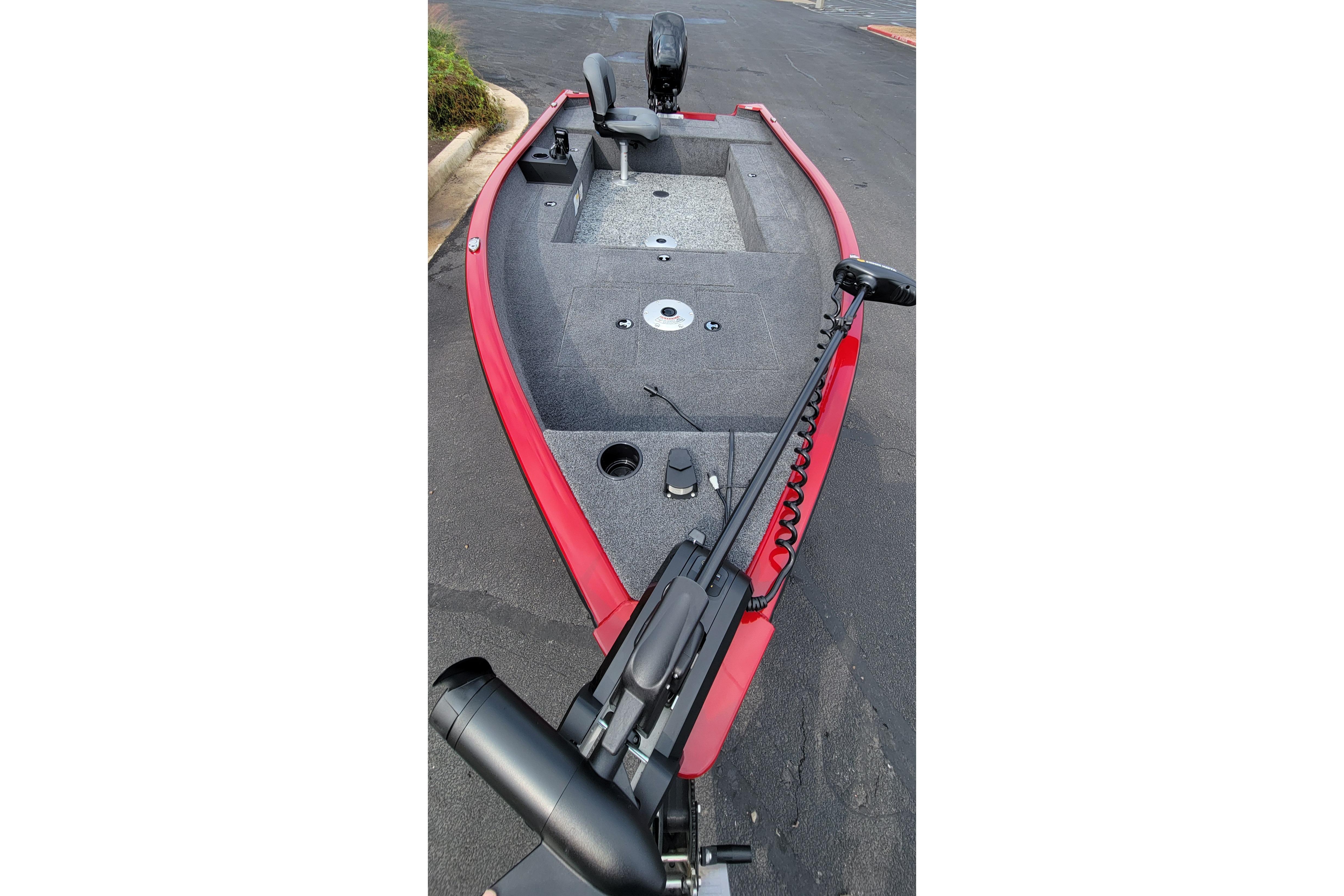 2025 Tracker Super Guide V-16 T fishing boat, red exterior, spacious deck, trolling motor.