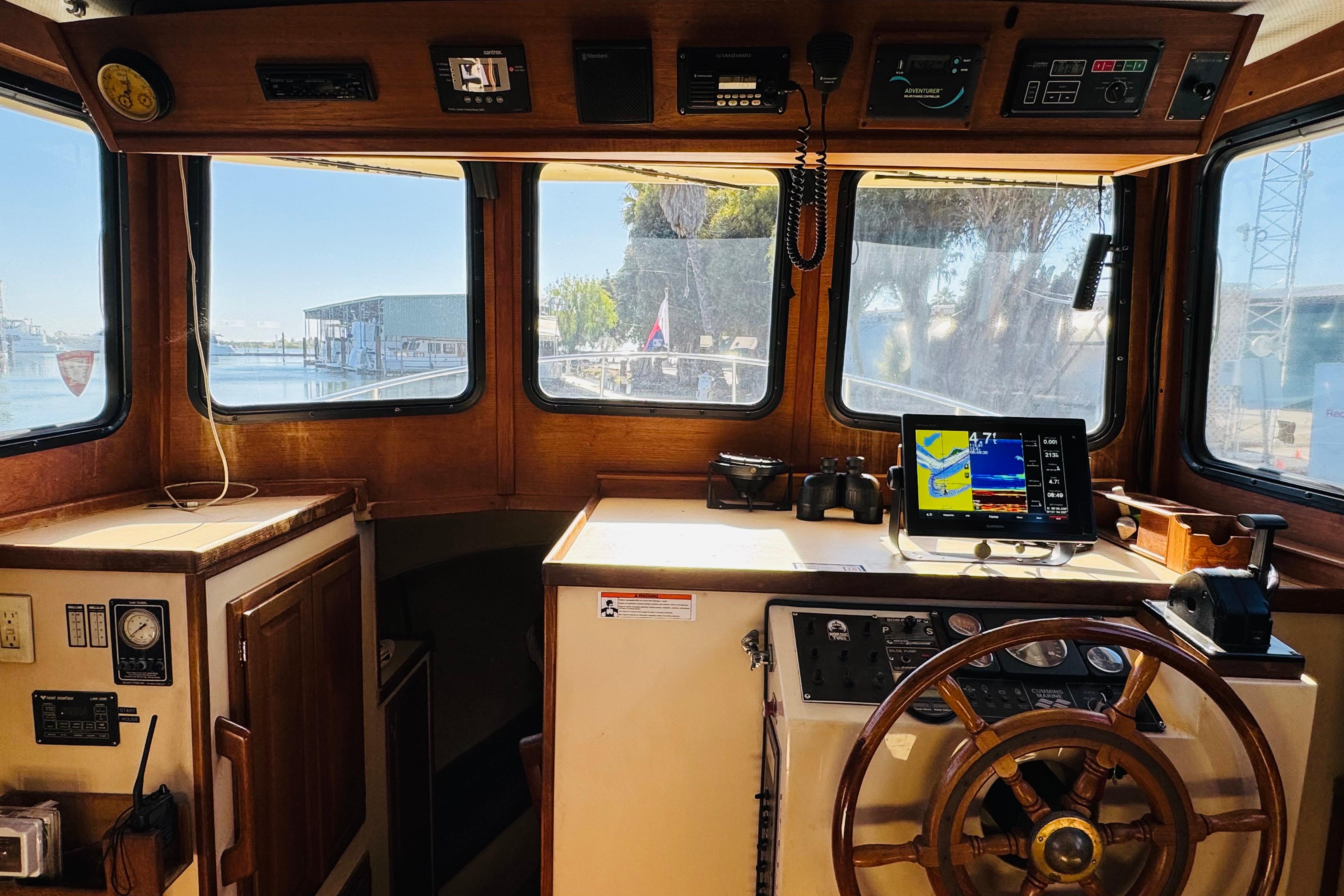 Interior view of a 1996 Nordic Tug 32 boat cockpit with navigation equipment.