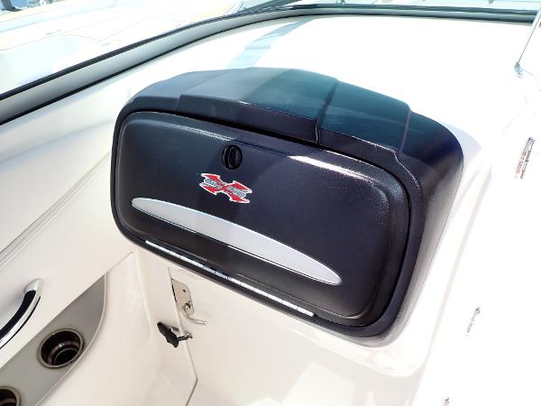 2011 Chaparral 287 SSX boat dashboard with storage compartment and logo.