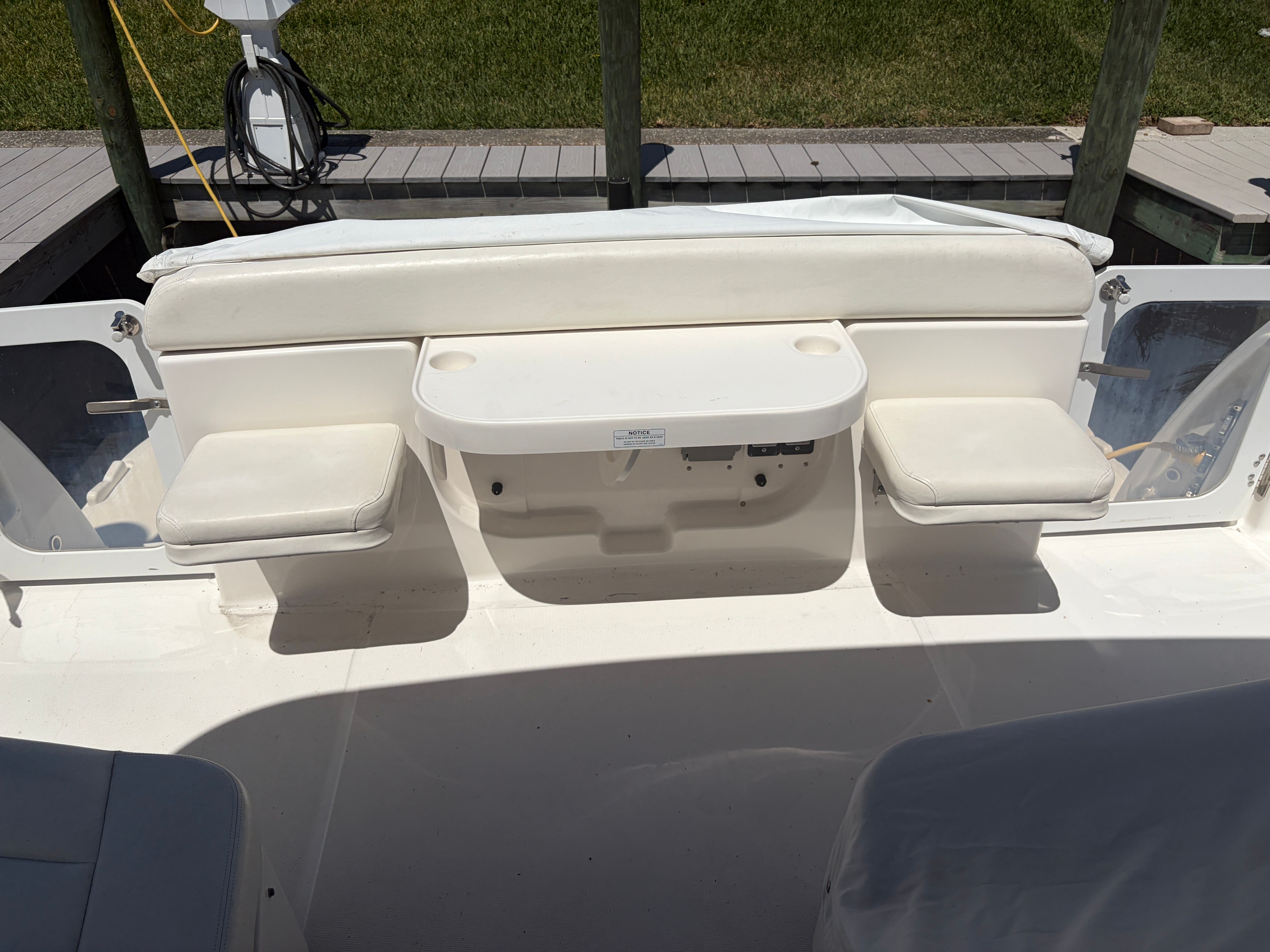 2005 Tiara Yachts Sovran outdoor seating area with table.