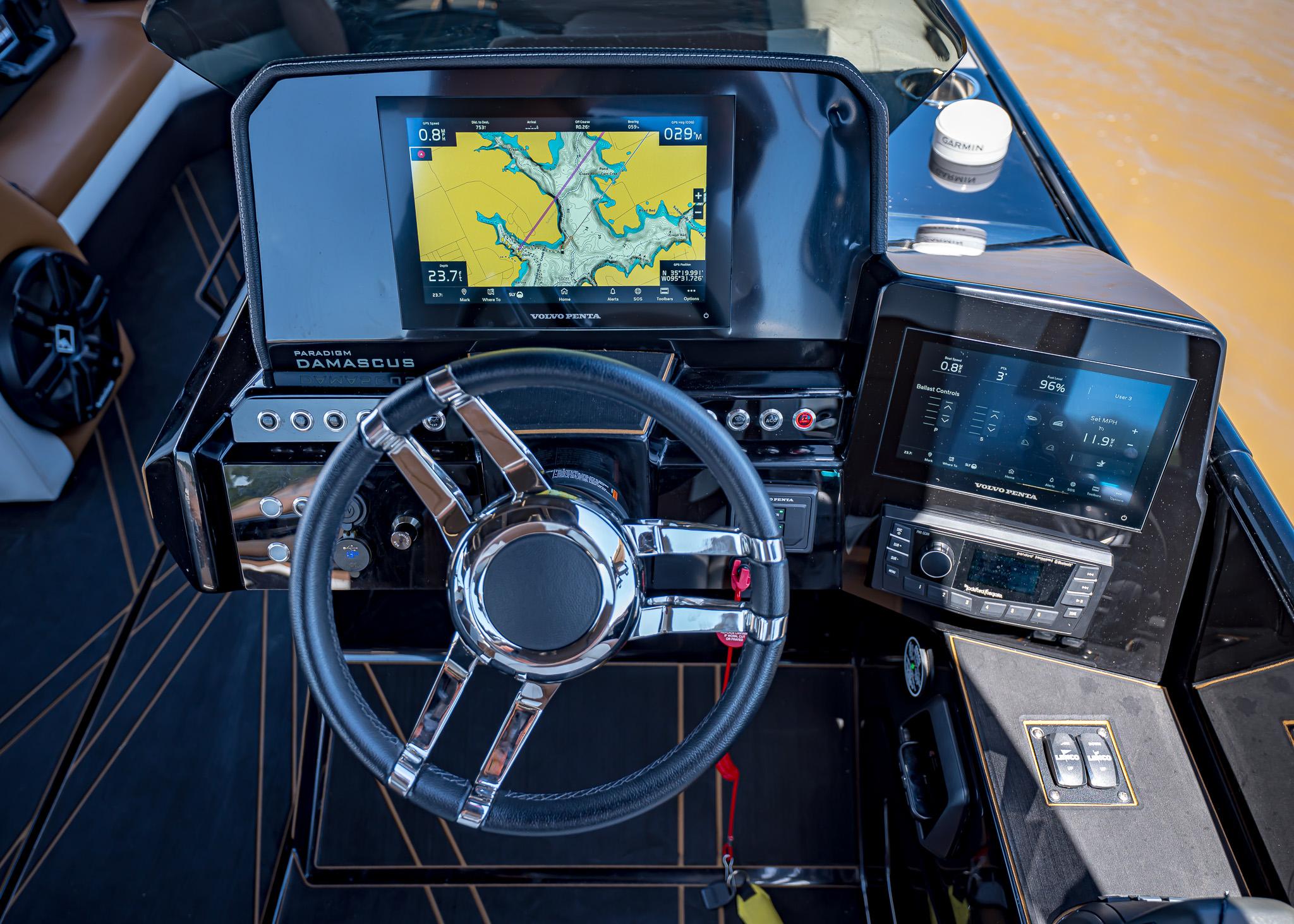 Steering console of 2025 Paradigm 236 boat with advanced navigation displays.