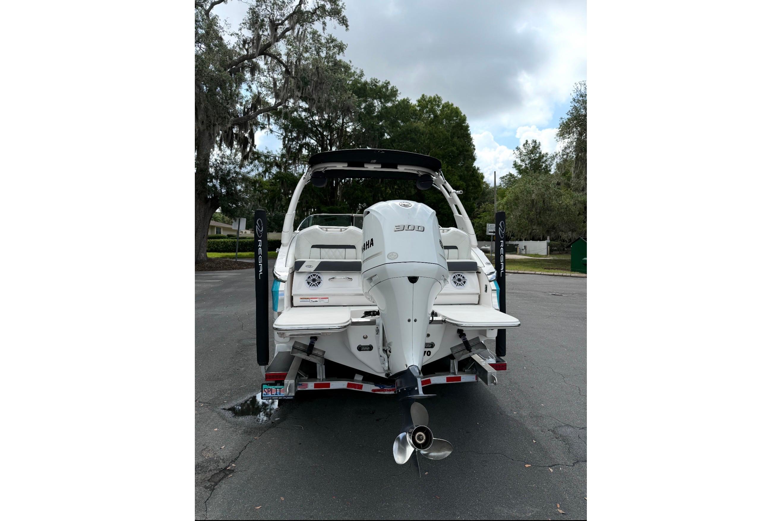 2020 Regal LX4 boat with Yamaha engine, parked outdoors on a cloudy day.