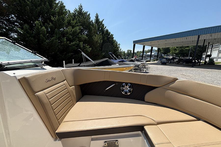 2019 Sea Ray SPX 230 Outboard boat interior with tan seating and sleek design.
